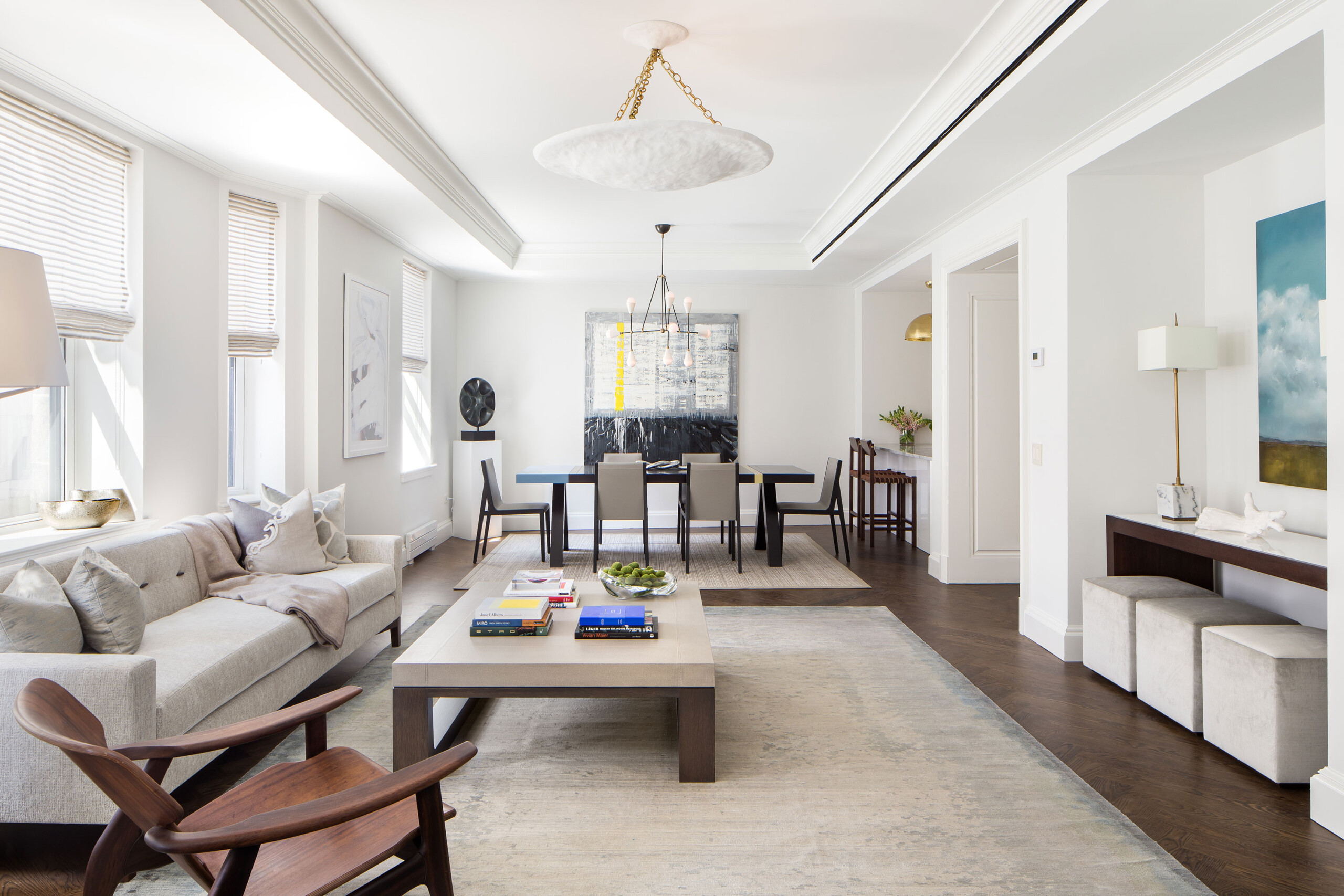 The Chatsworth - Modern living room with white and wood tones in luxury condominium. Interior design...
