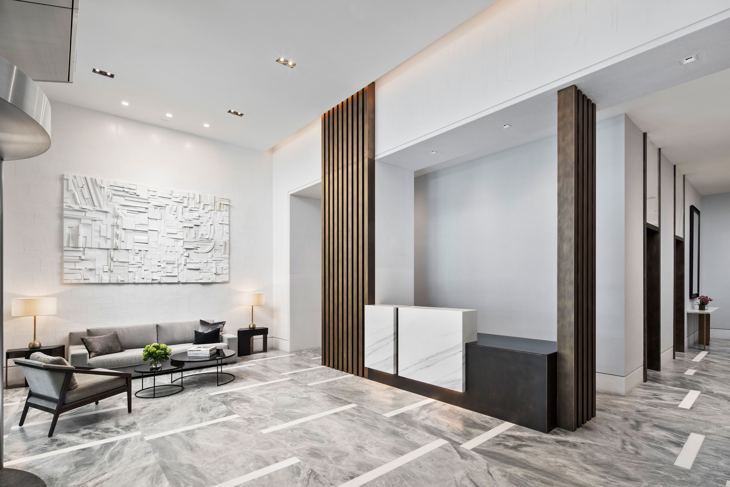 111 West 67th Street - Luxury lobby with seating in Upper West Side, featuring neutral tones. Interior...
