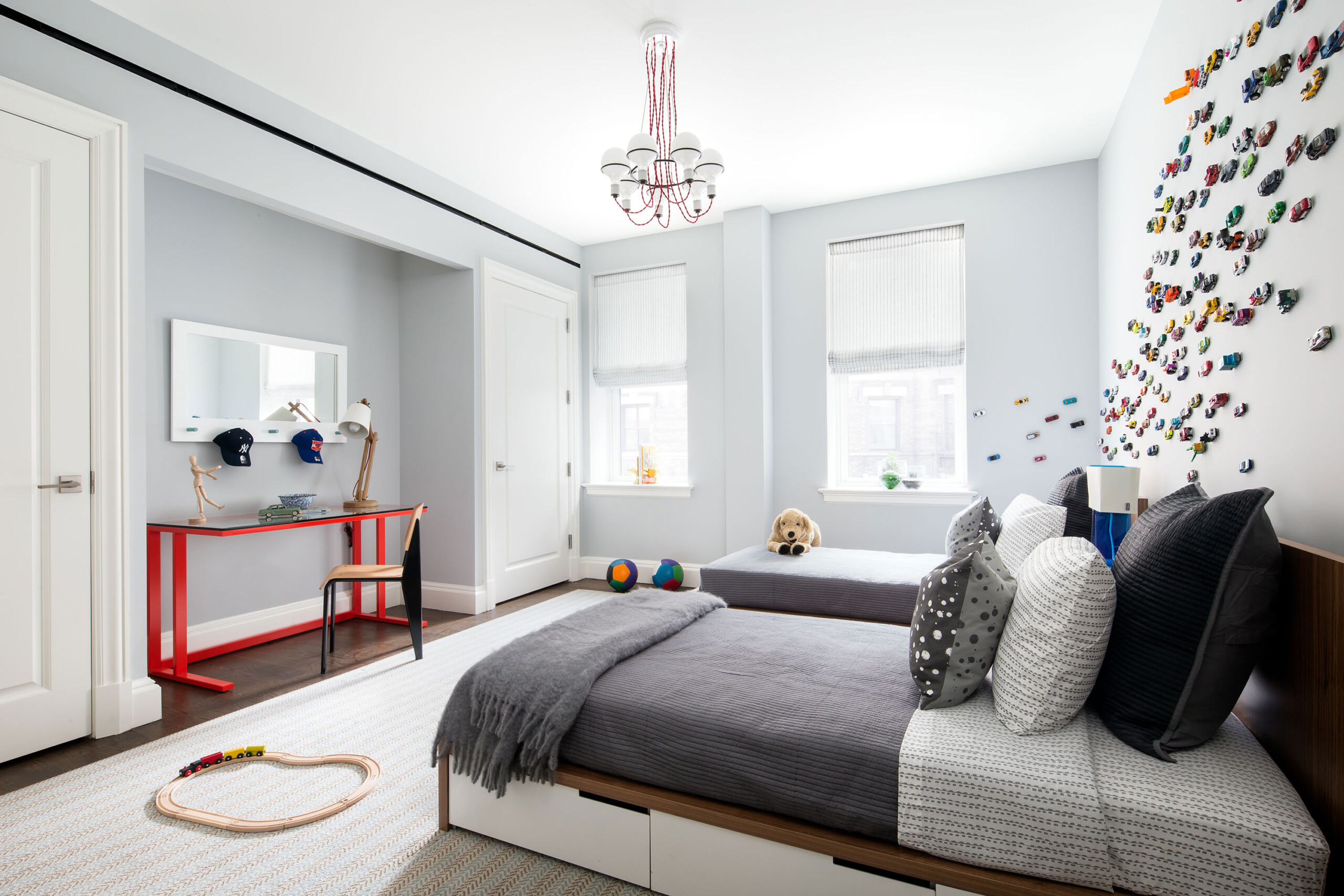 The Chatsworth - Luxury children's bedroom with two twin beds and colorful accents. Interior design...