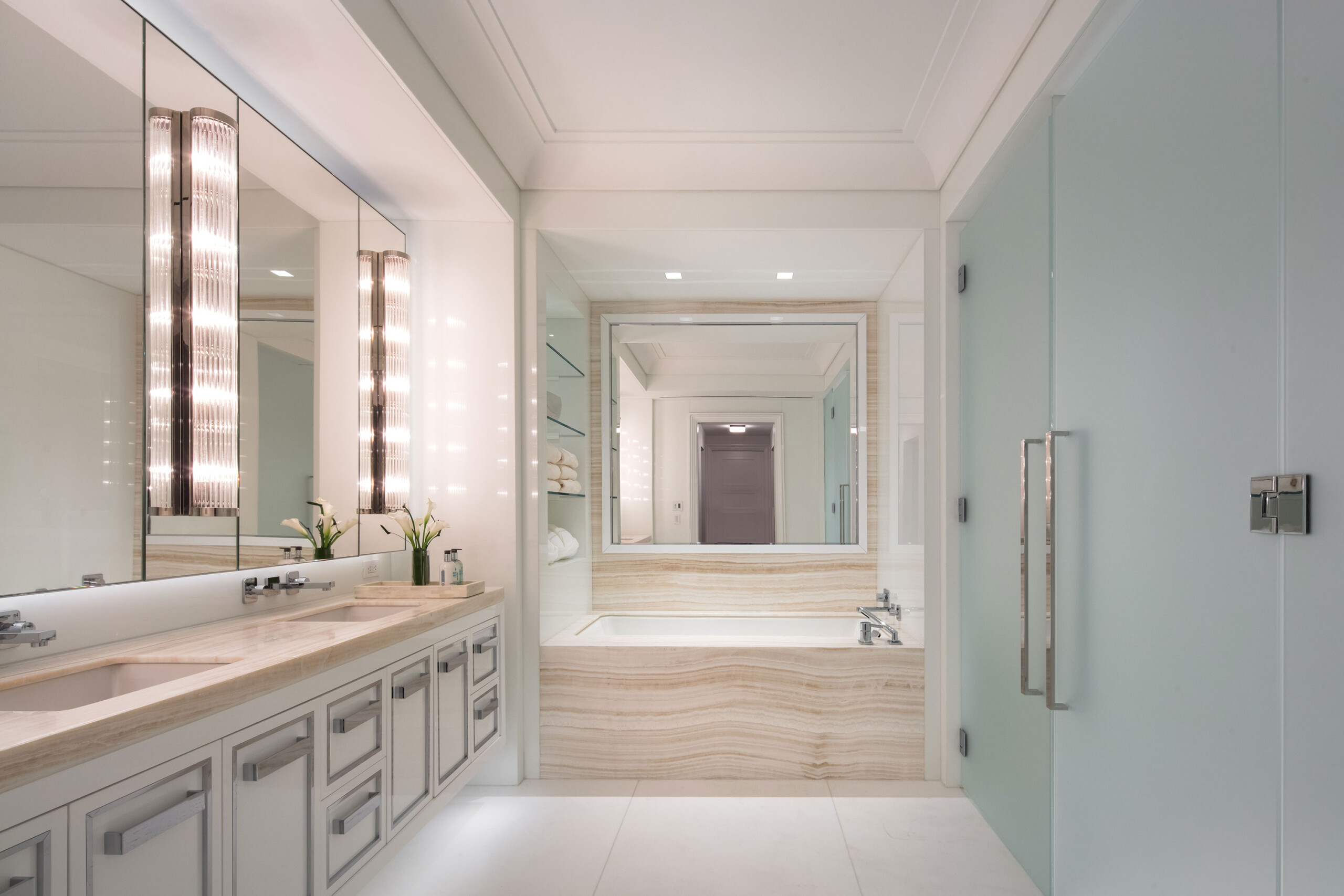 155 East 79th Street - Modern luxury bathroom design with whote, frosted glass, andtextured stone...