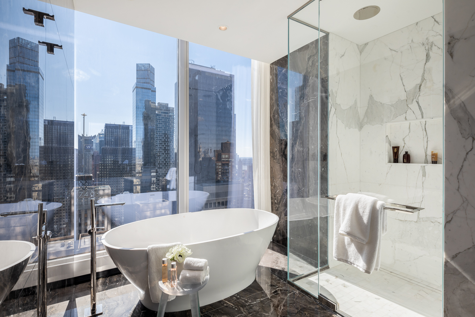 Central Park Tower - Pembrooke & Ives A modern luxury bathroom in New York, NY. Interior design...