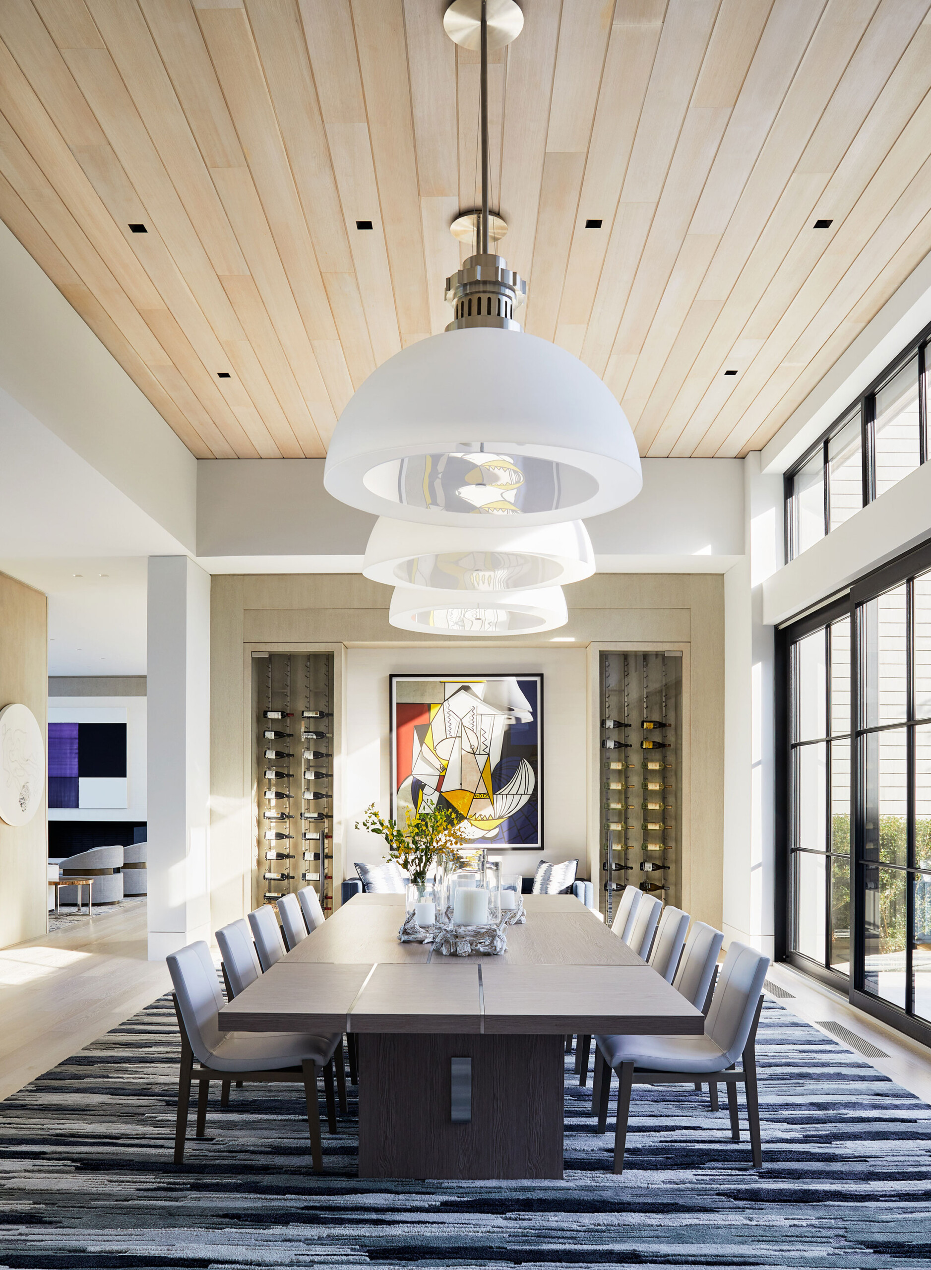 Southampton Estate - Pembrooke & Ives - Grand modern dining room with statement domed chandeliers,...