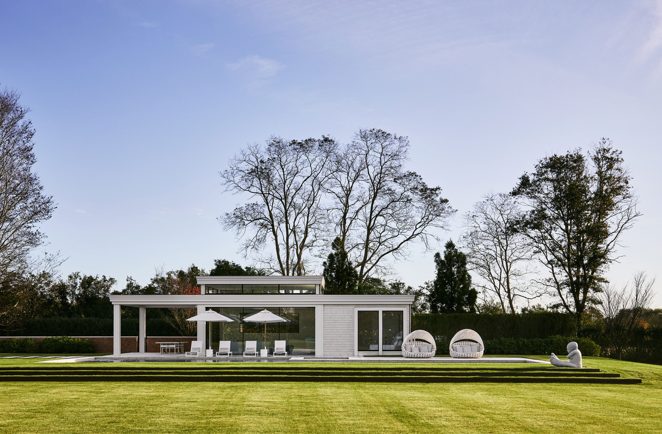 Southampton Estate - Pembrooke & Ives - Outdoor backyard facade of Southampton Estate. Design by...