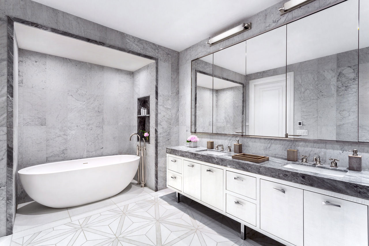 212 Fifth Avenue - White and great stone bathroom with modern double vanity sinks and bathtub cove....