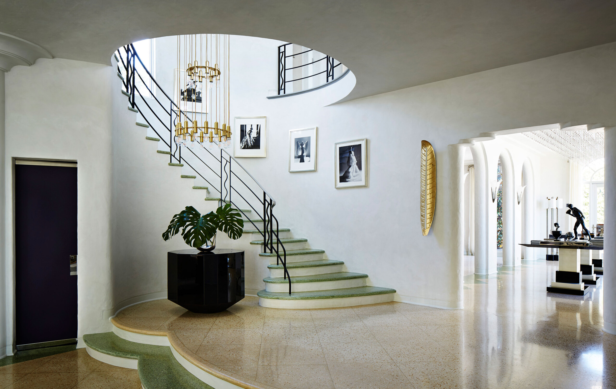 Historic West Palm Beach - West Palm Beach luxury home entryway with curved staircase and rounded...