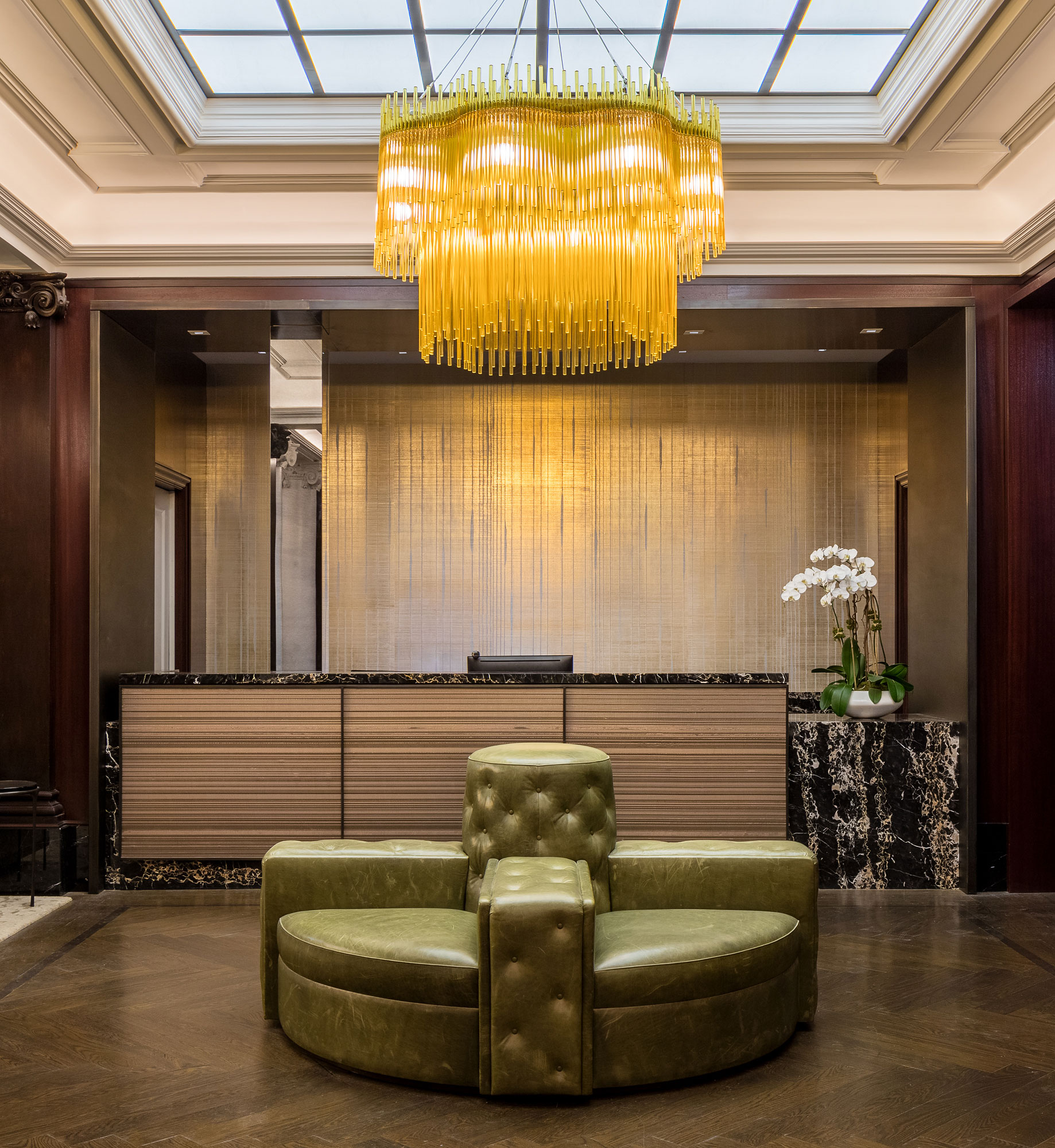 The Chatsworth - The Chatsworth lobby lounge area with statement chandelier. Interior design by...