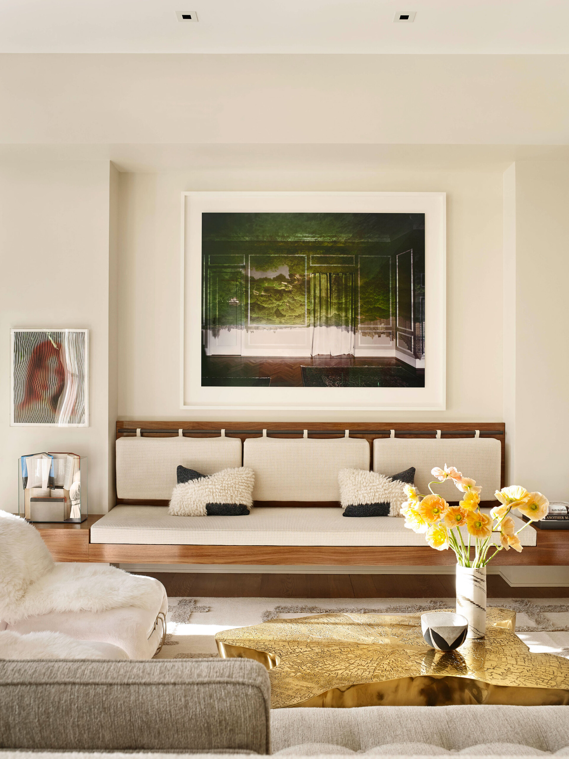 Madison Square Park - Living room detail with gold coffee table and bench seating in New York apartment....