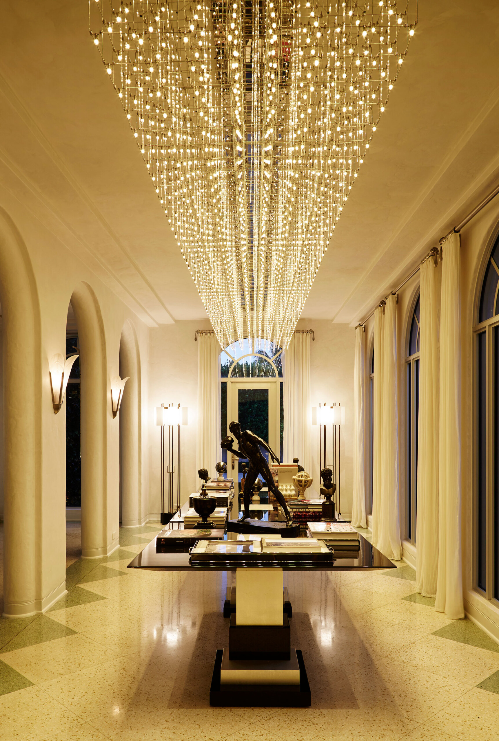 Historic West Palm Beach - Luxury hallway with arched doorways and windows, featuring statement...