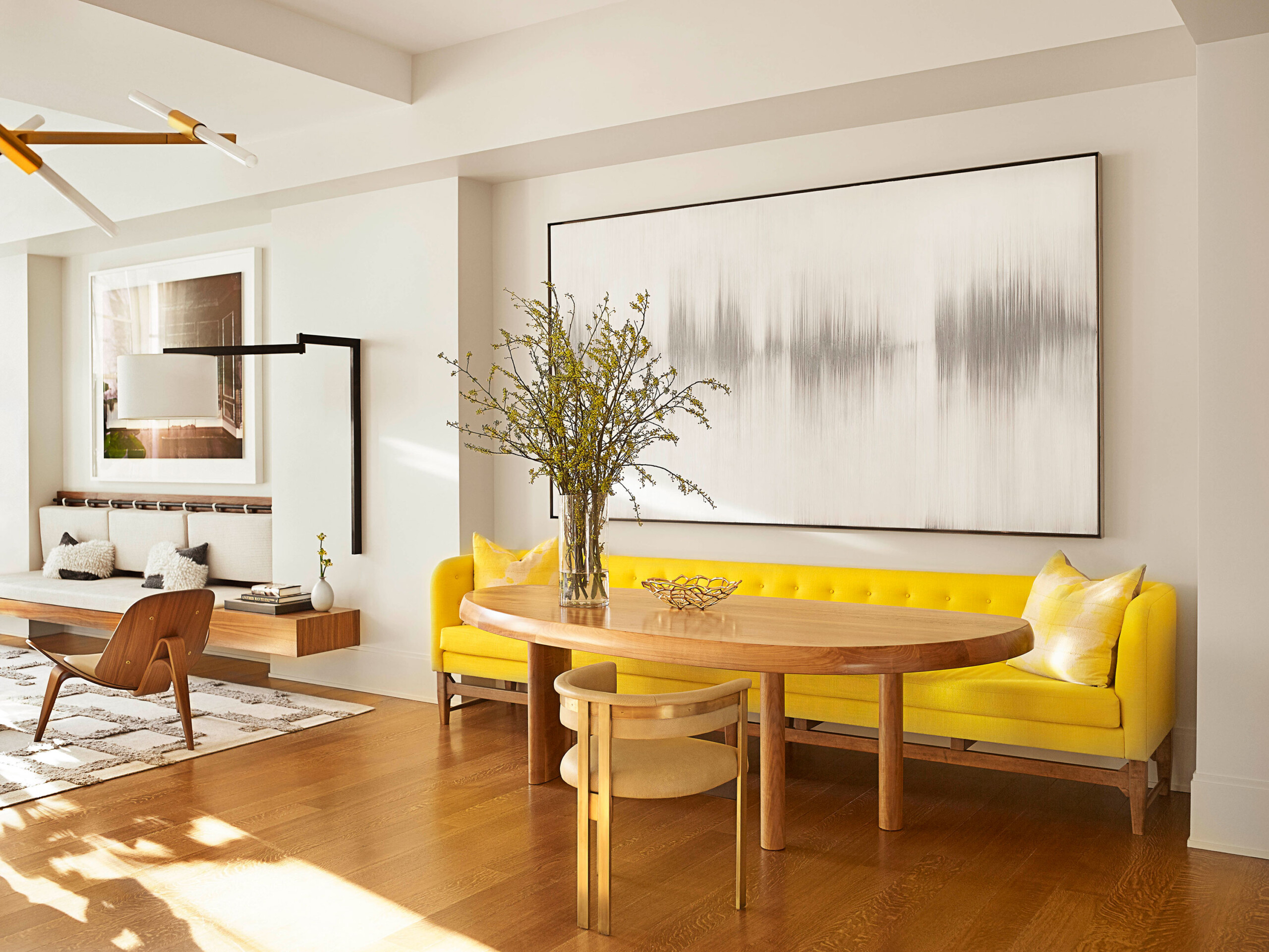 Madison Square Park - Mid-century modern dining area of New York apartment featuring bright yellow...