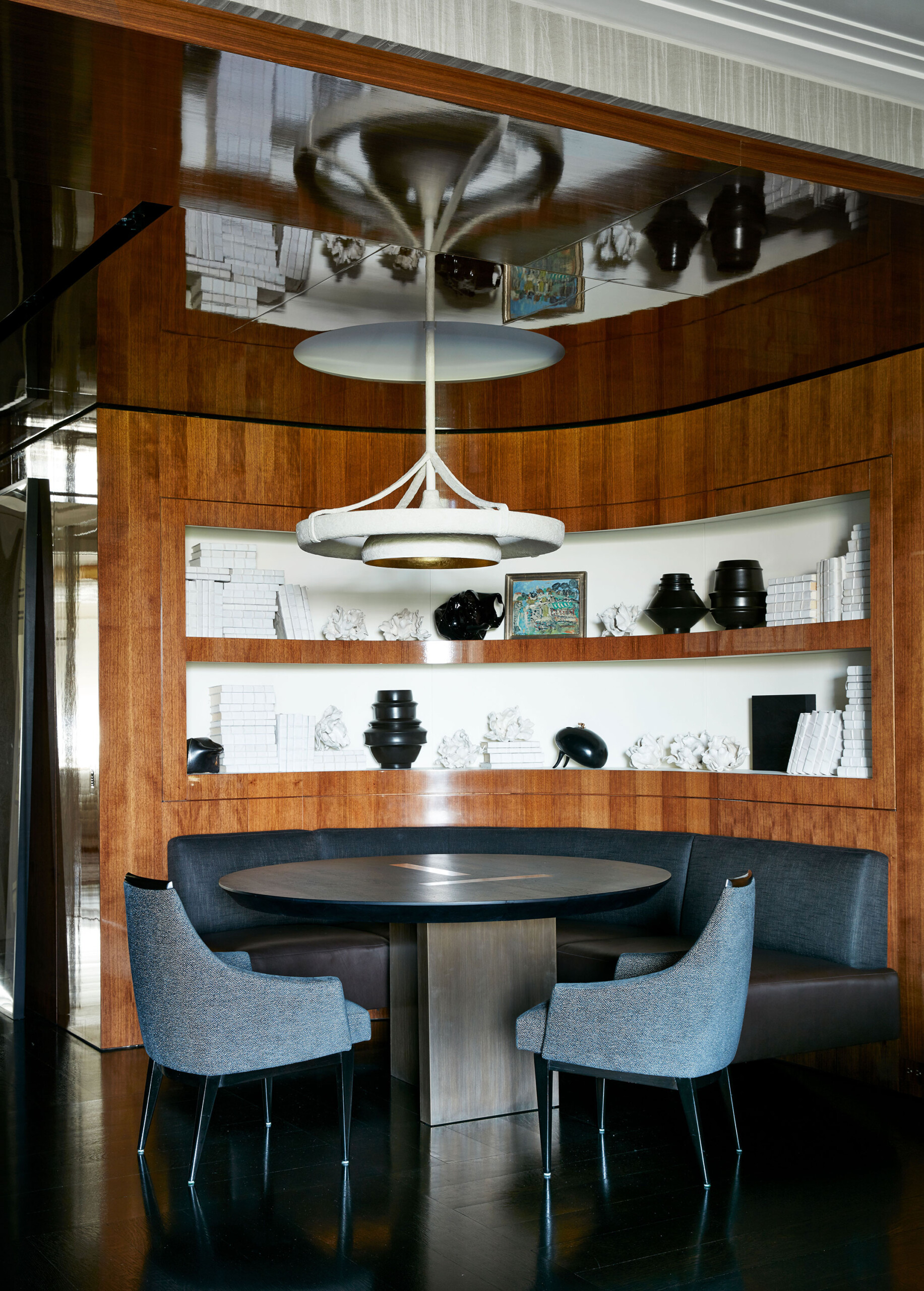 Fifth Avenue Pied-a-Terre - Pembrooke & Ives Contemporary dining room with round table, upholstered...