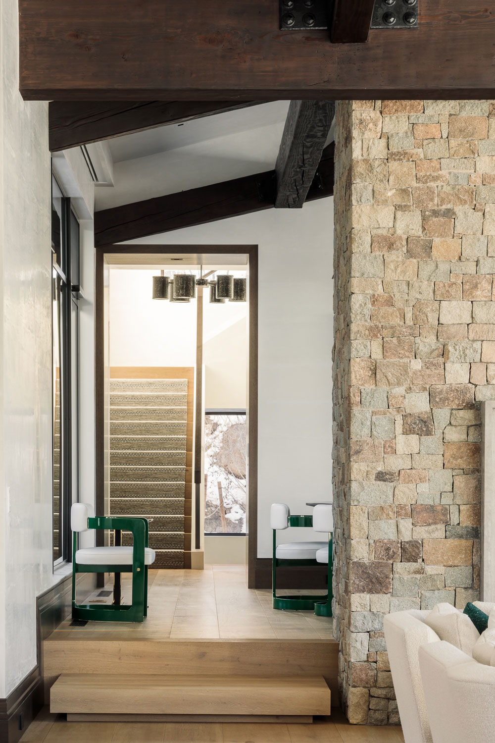 Red Mountain - Hallway of Red Mountain vacation home with light wood floors, stone fireplace, and...