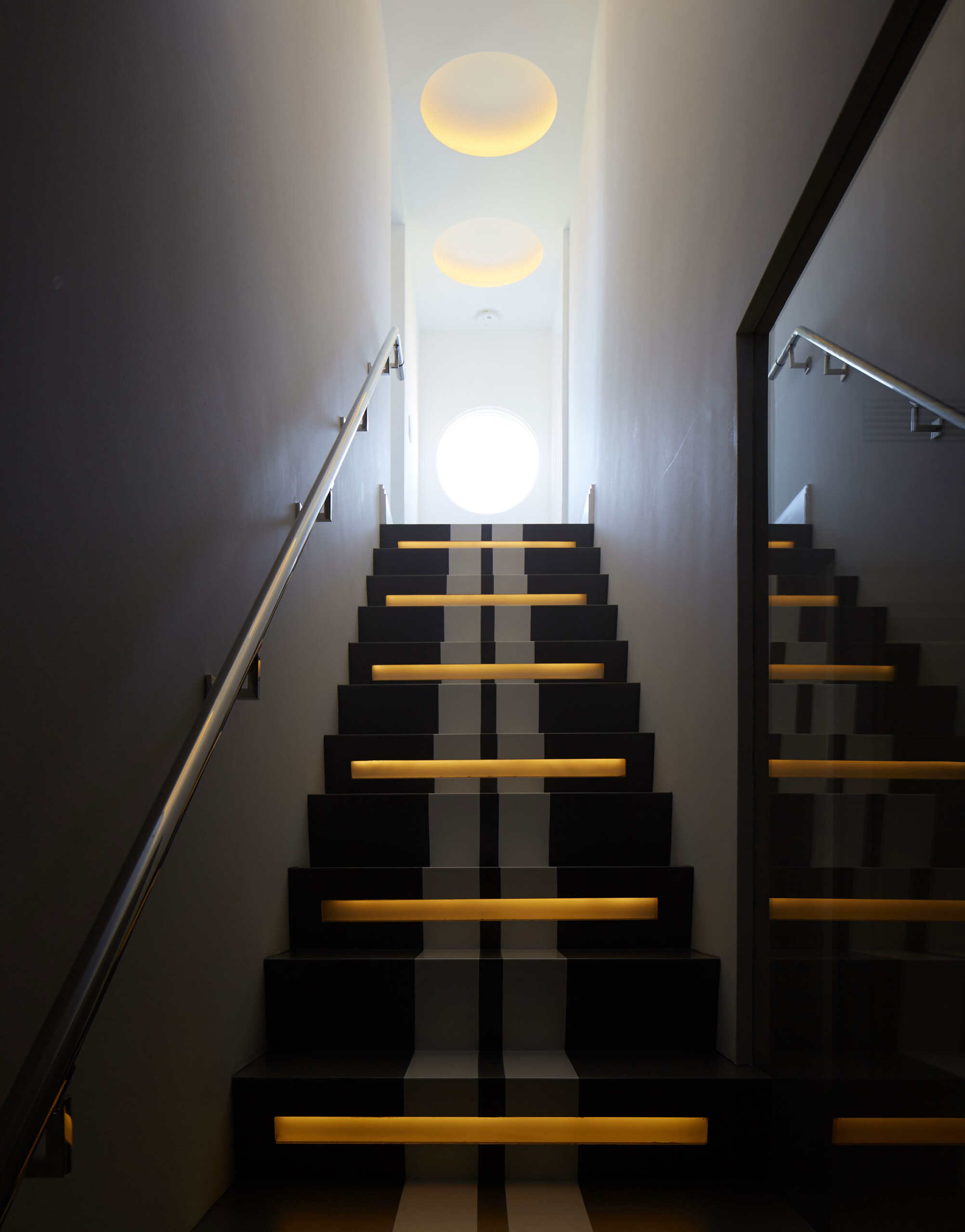 Historic West Palm Beach - Illuminated staircase in West Palm Beach home. Interior design by Pembrooke...
