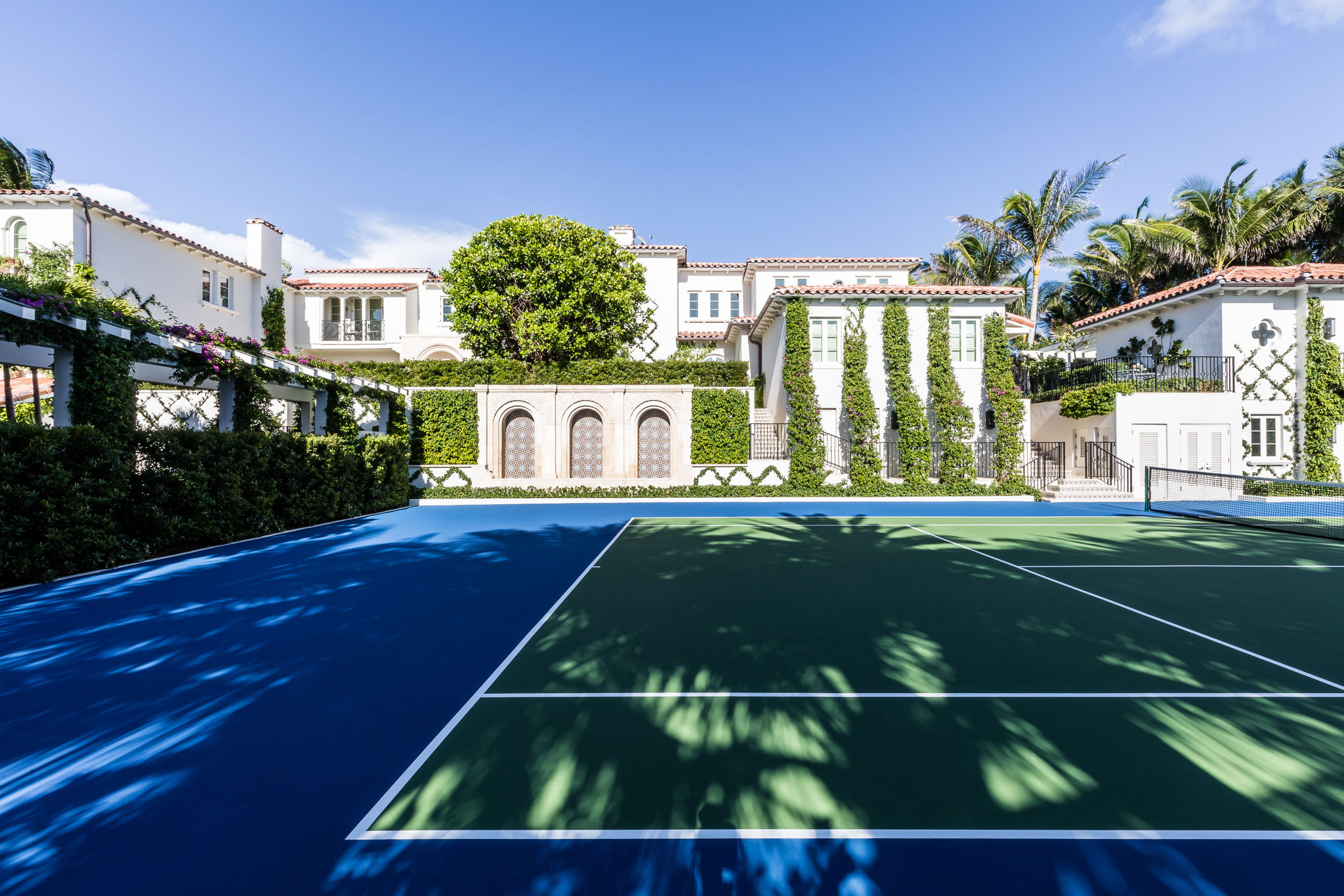 Ocean-front Compound - Outdoor tennis court in coastal ocean-front luxury estate. Design by Pembrooke...
