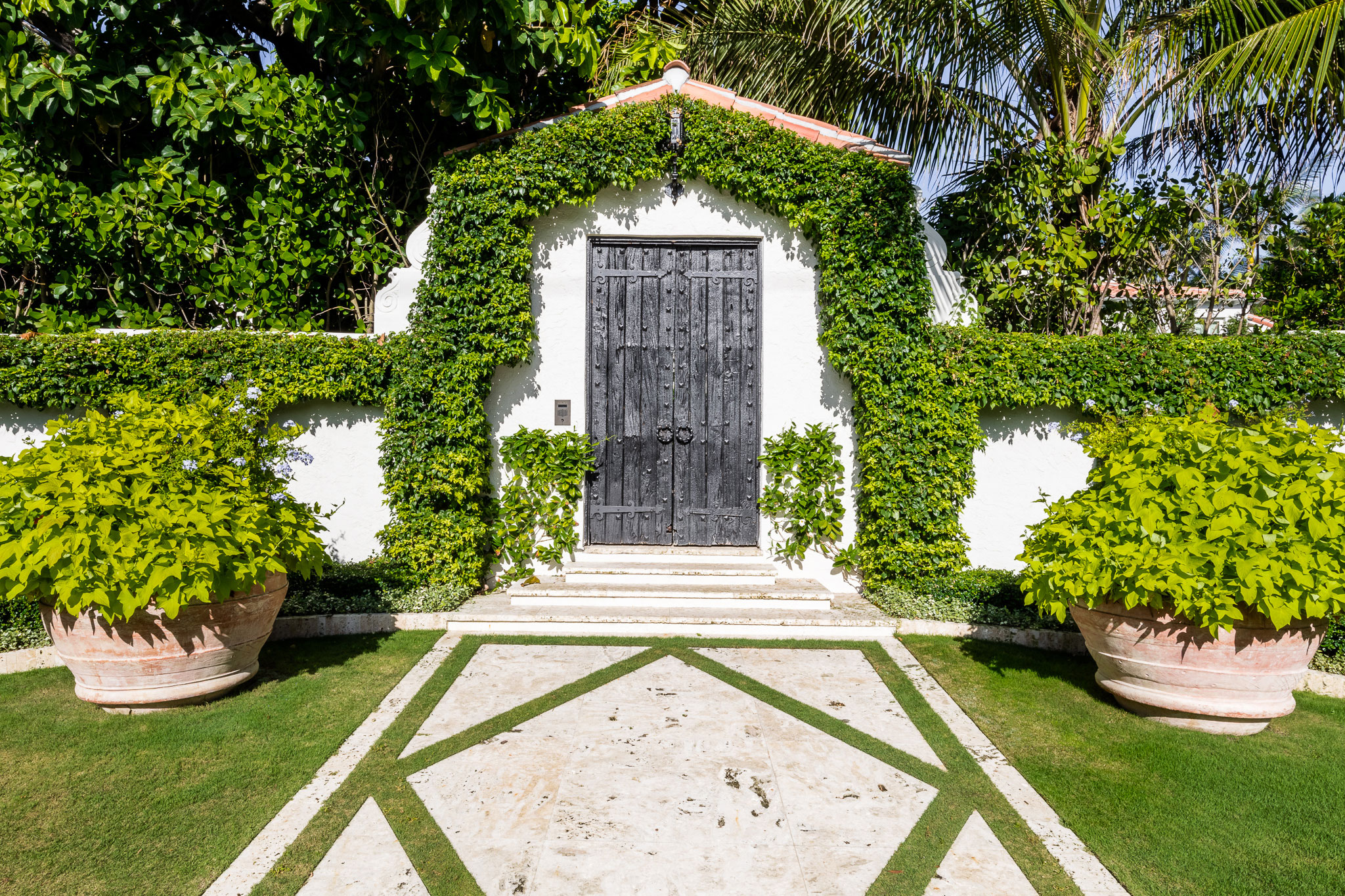 Ocean-front Compound - Coastal ocean-front compound features a shed with geometric pavement walkway...