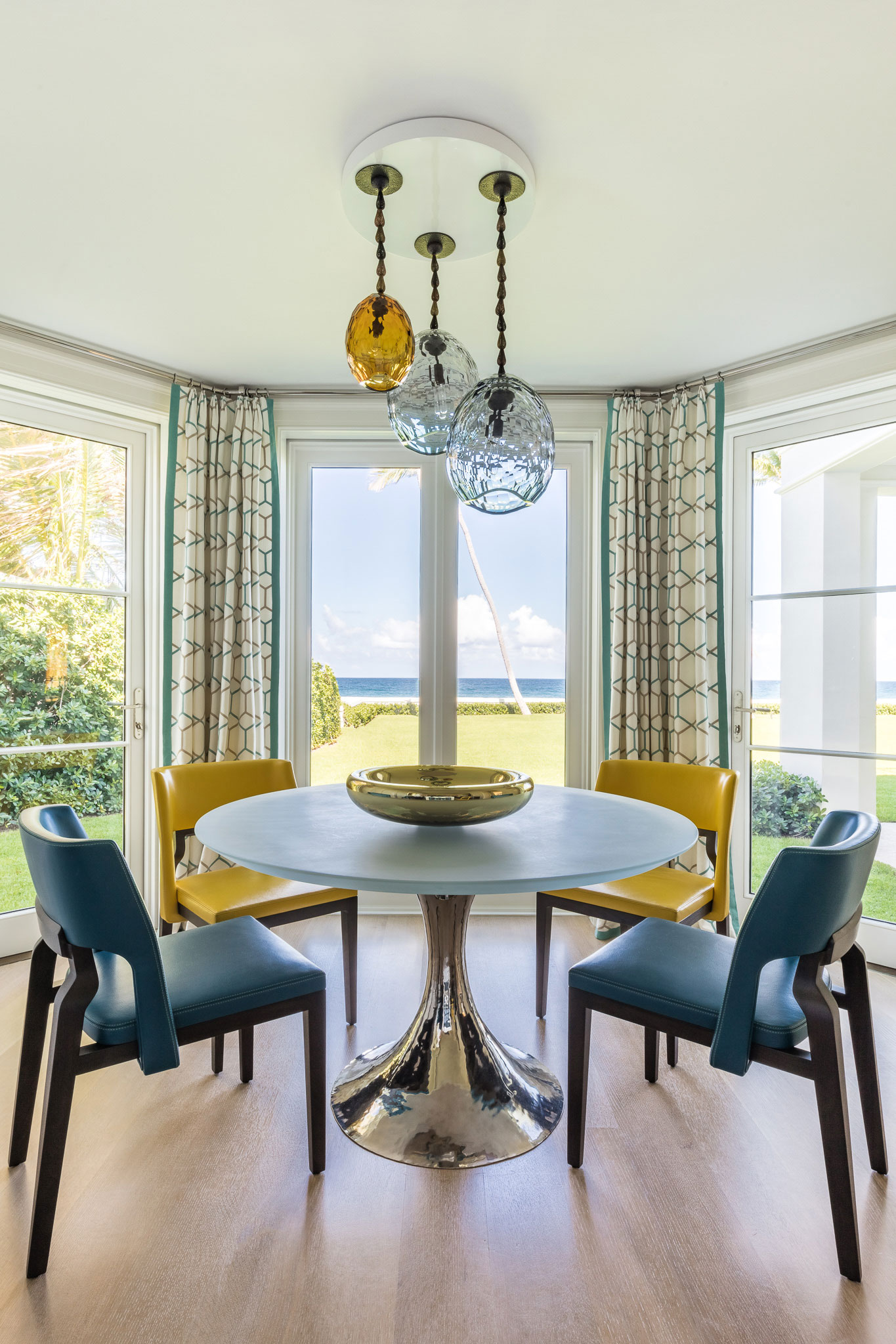 Ocean-front Compound - Colorful dining room with yellow and blue tones to accent the luxury home's...