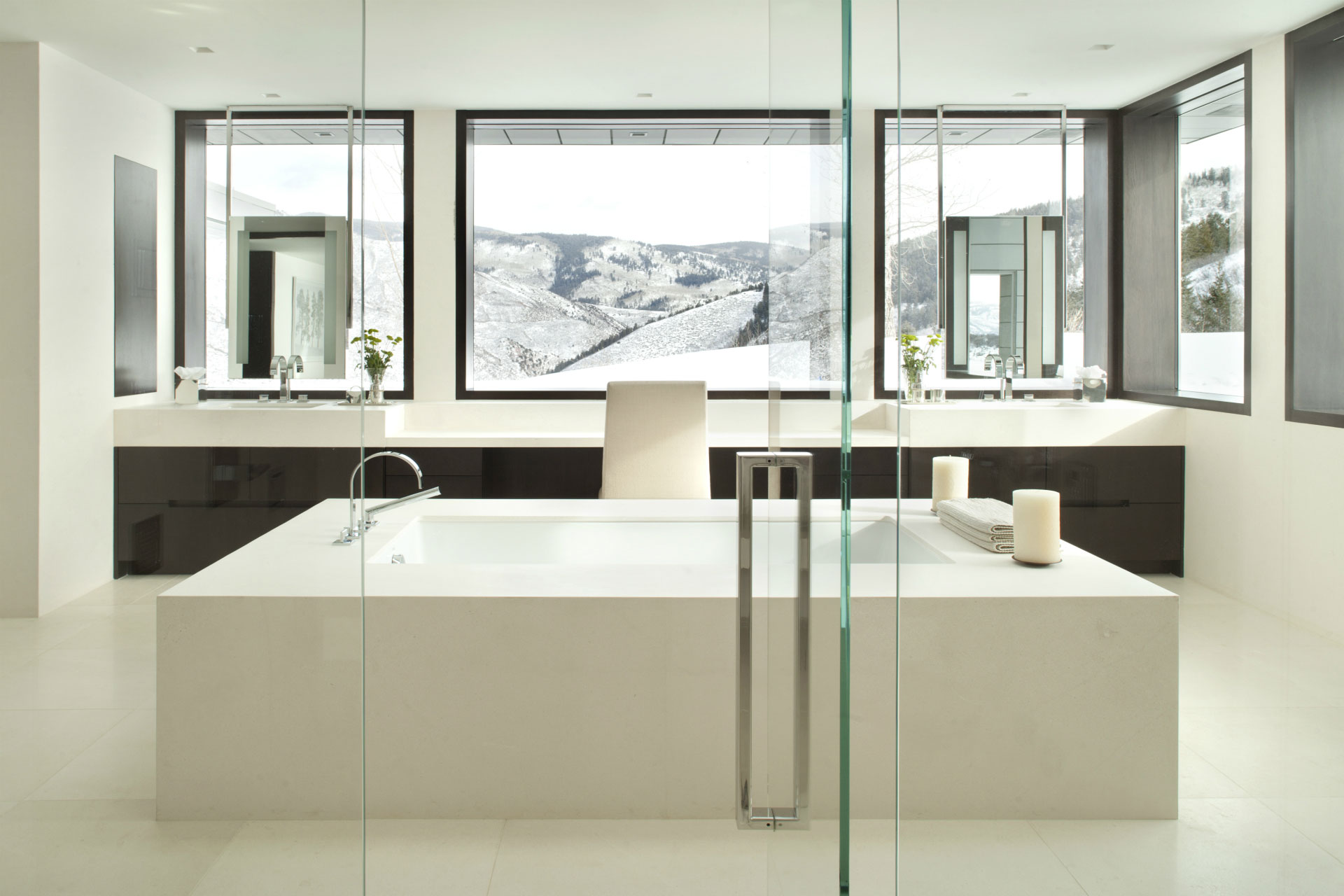 Modern Mountain - Modern bathroom design with white squared tub and dark wood cabinetry. Interior...