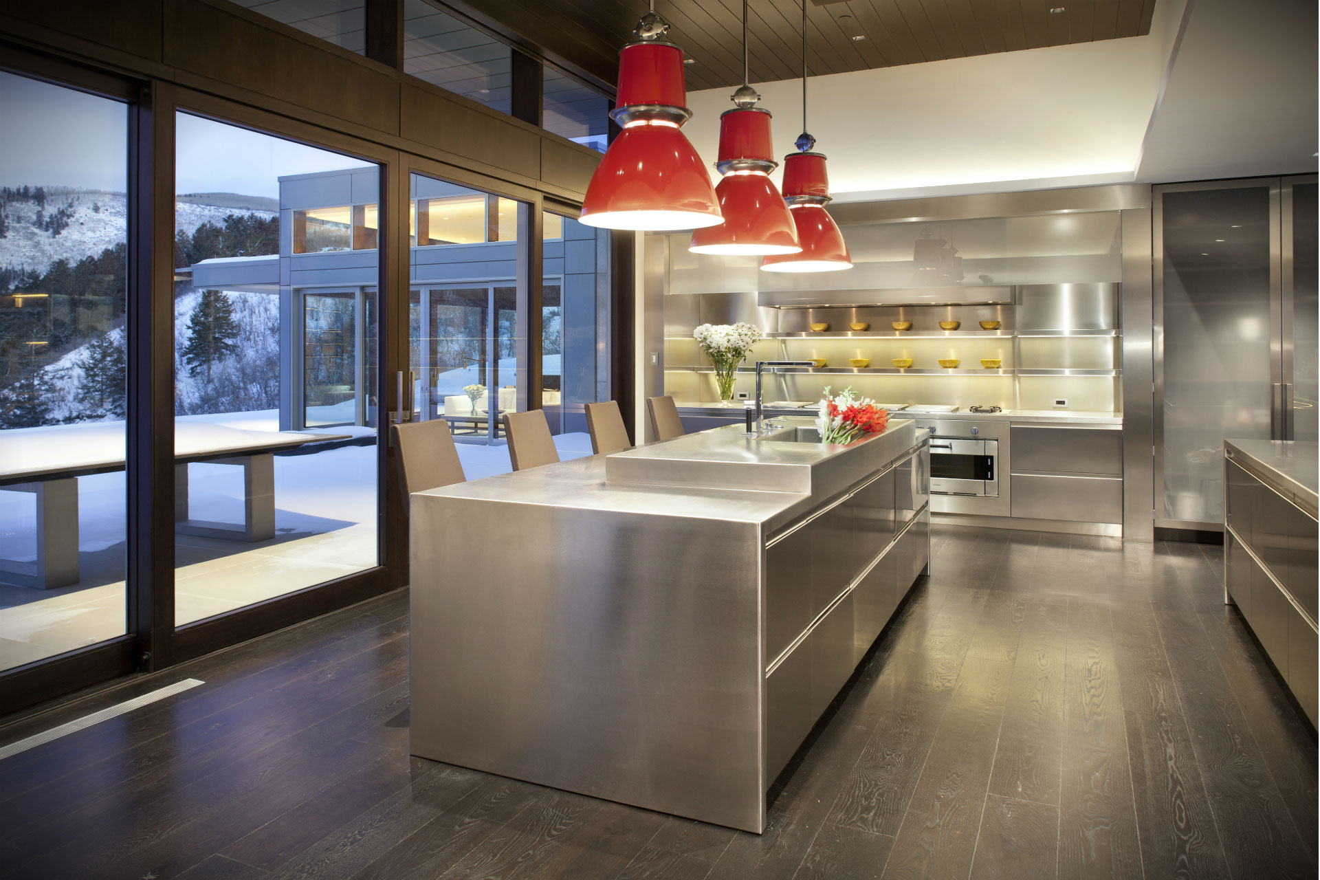 Modern Mountain - Modern kitchen with stainless steel kitchen island, appliances, and cabinetry....