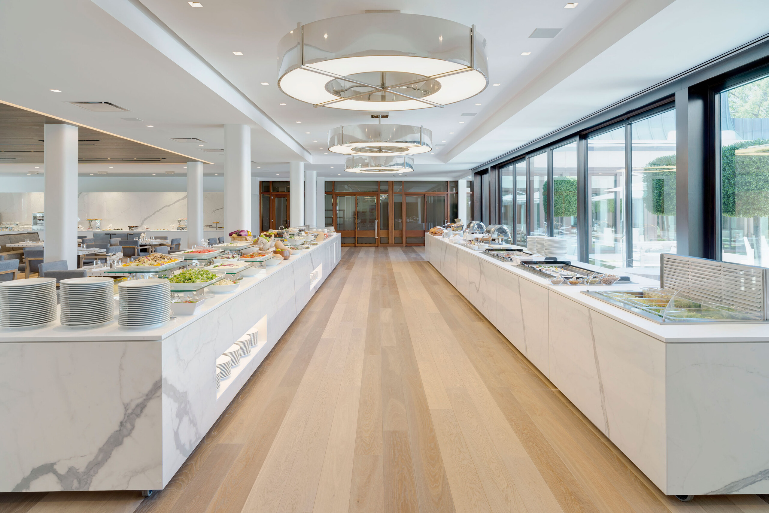 Glen Oaks Club - White marble buffet tables in Long Island country club. Interior hospitality design...