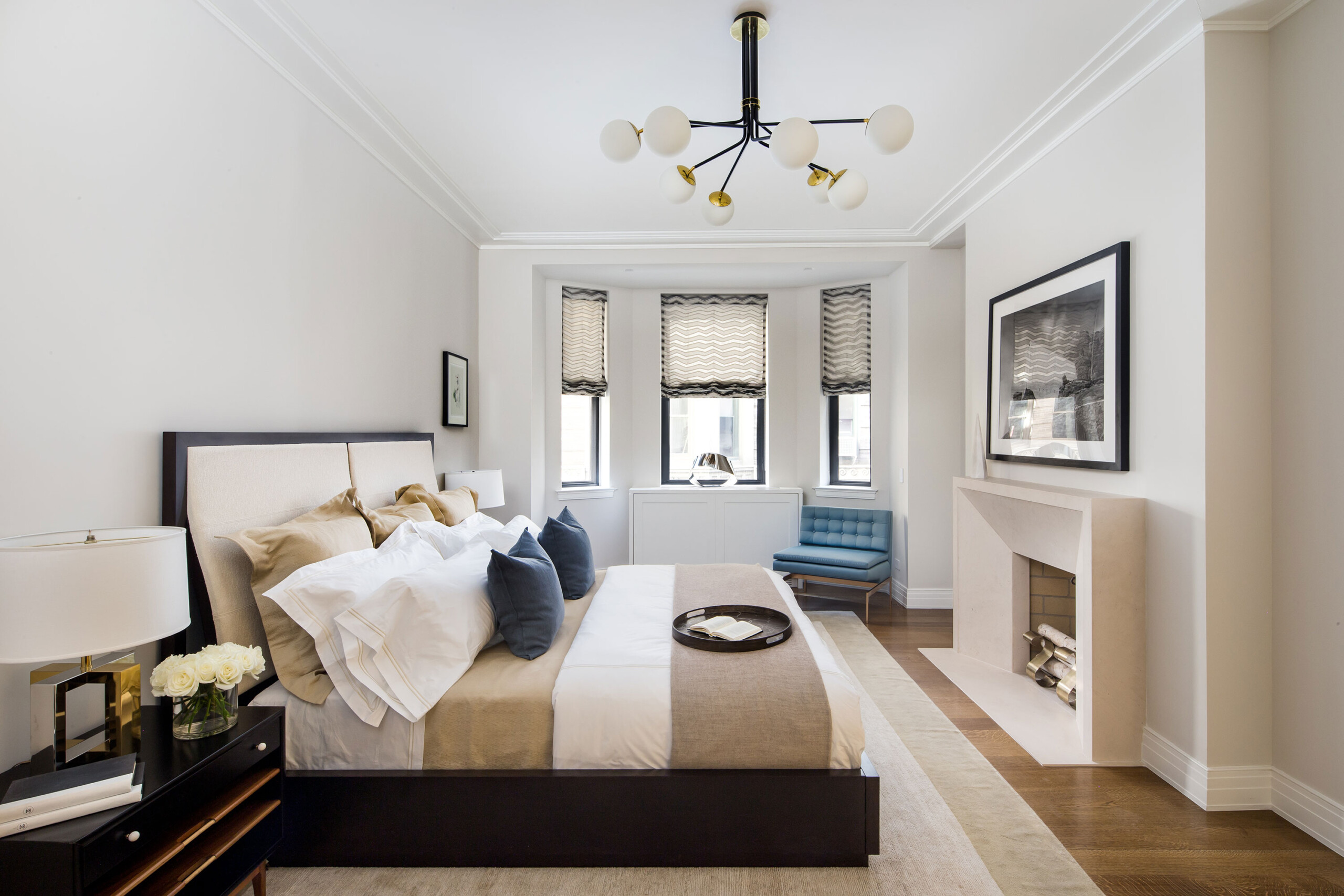 The Astor - Luxury bedroom with neutral tones in The Astor, New York. Interior design by Pembrooke...