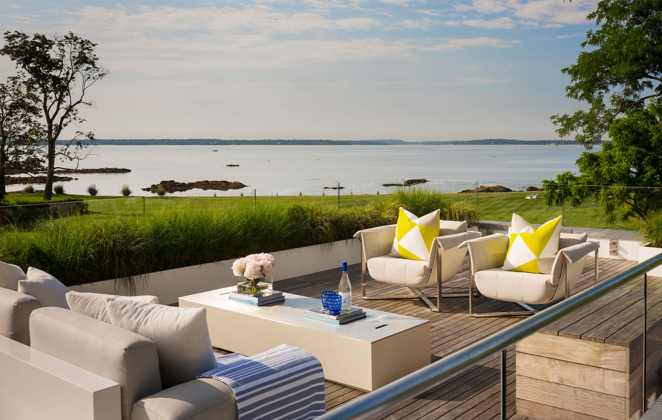 Rye Pool House - Outdoor lounge seating of Rye pool house patio area. Design by Pembrooke & Ives....