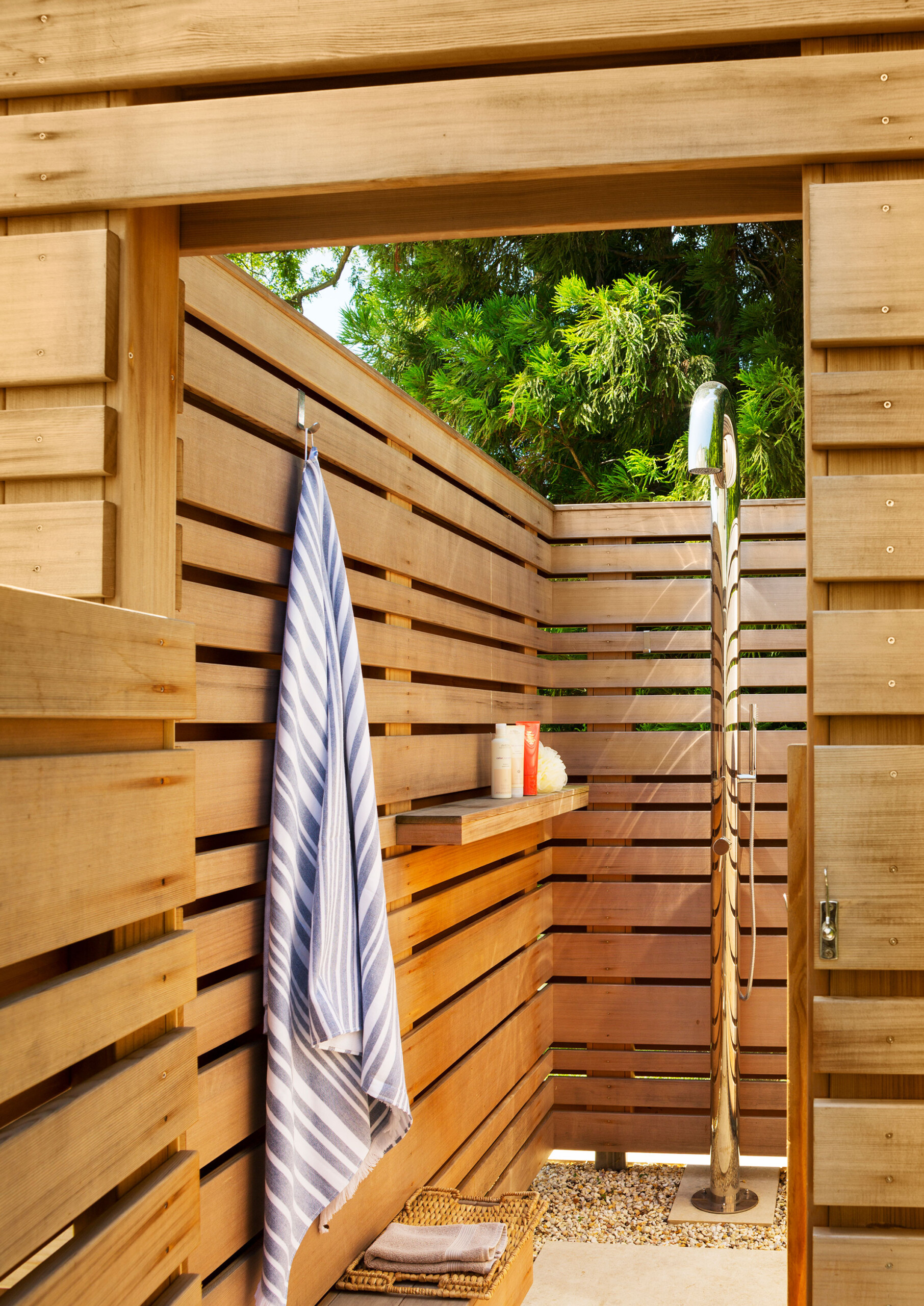 Rye Pool House - Outdoor shower in luxury pool house. Interior design by Pembrooke & Ives. Photography...