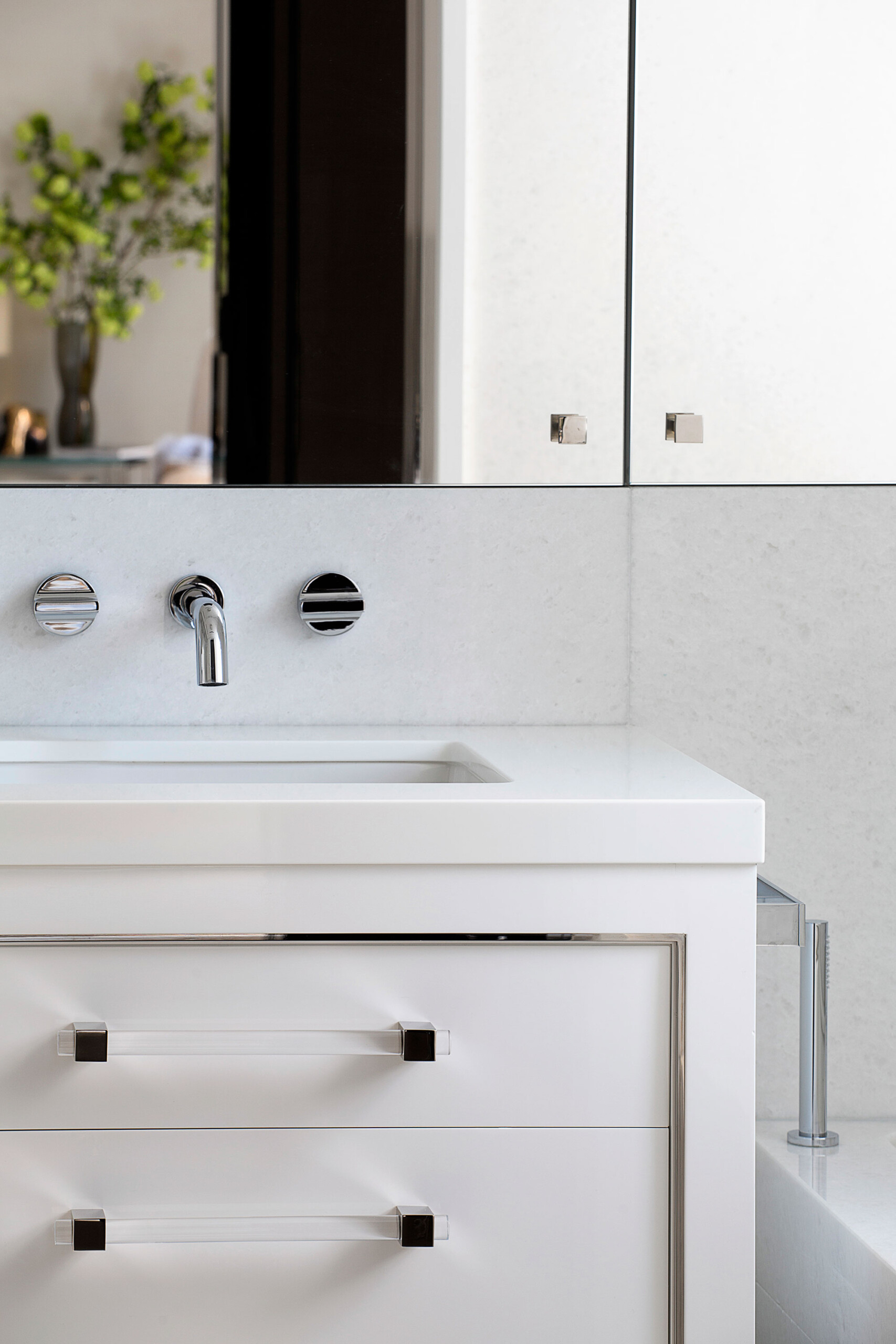 Glamour on Park - Polished nickel hardware with clear acrylic accents and white bathroom vanity...