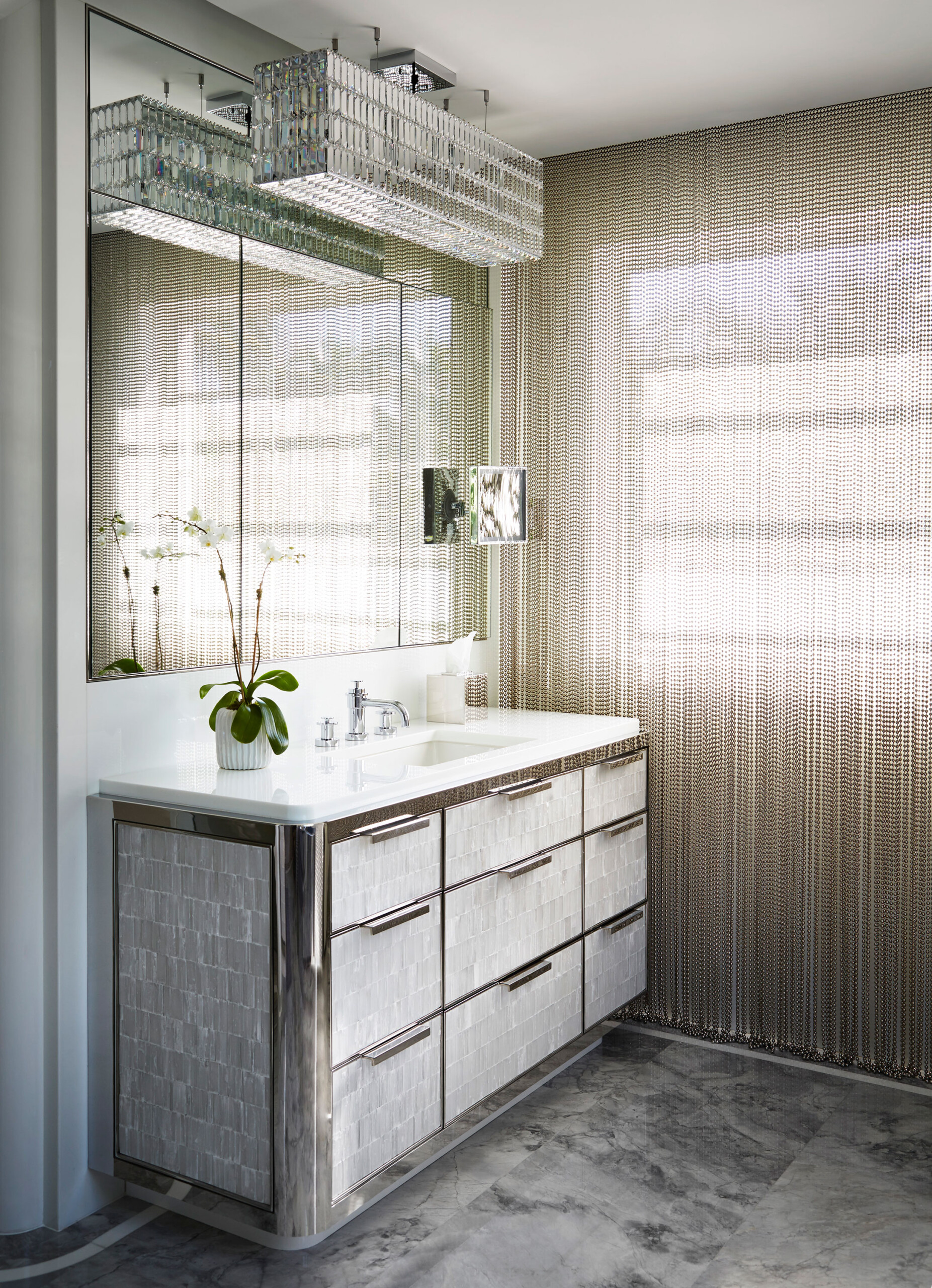 Historic West Palm Beach - Monochromatic luxury bathroom vanity with chrome and textured finishes....