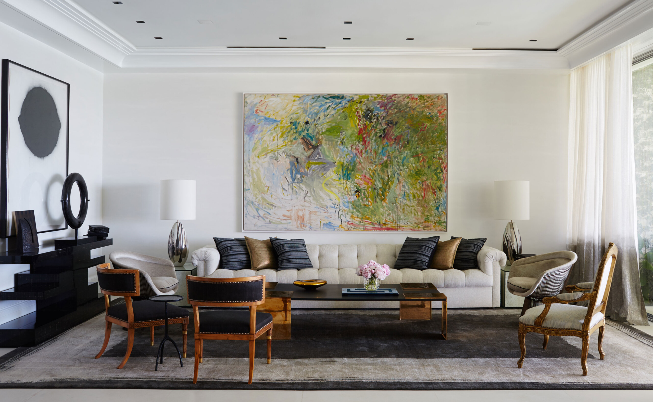 Lakefront Home - Living room of Palm Beach, FL home with beige tufted sofa, wooden upholstered...