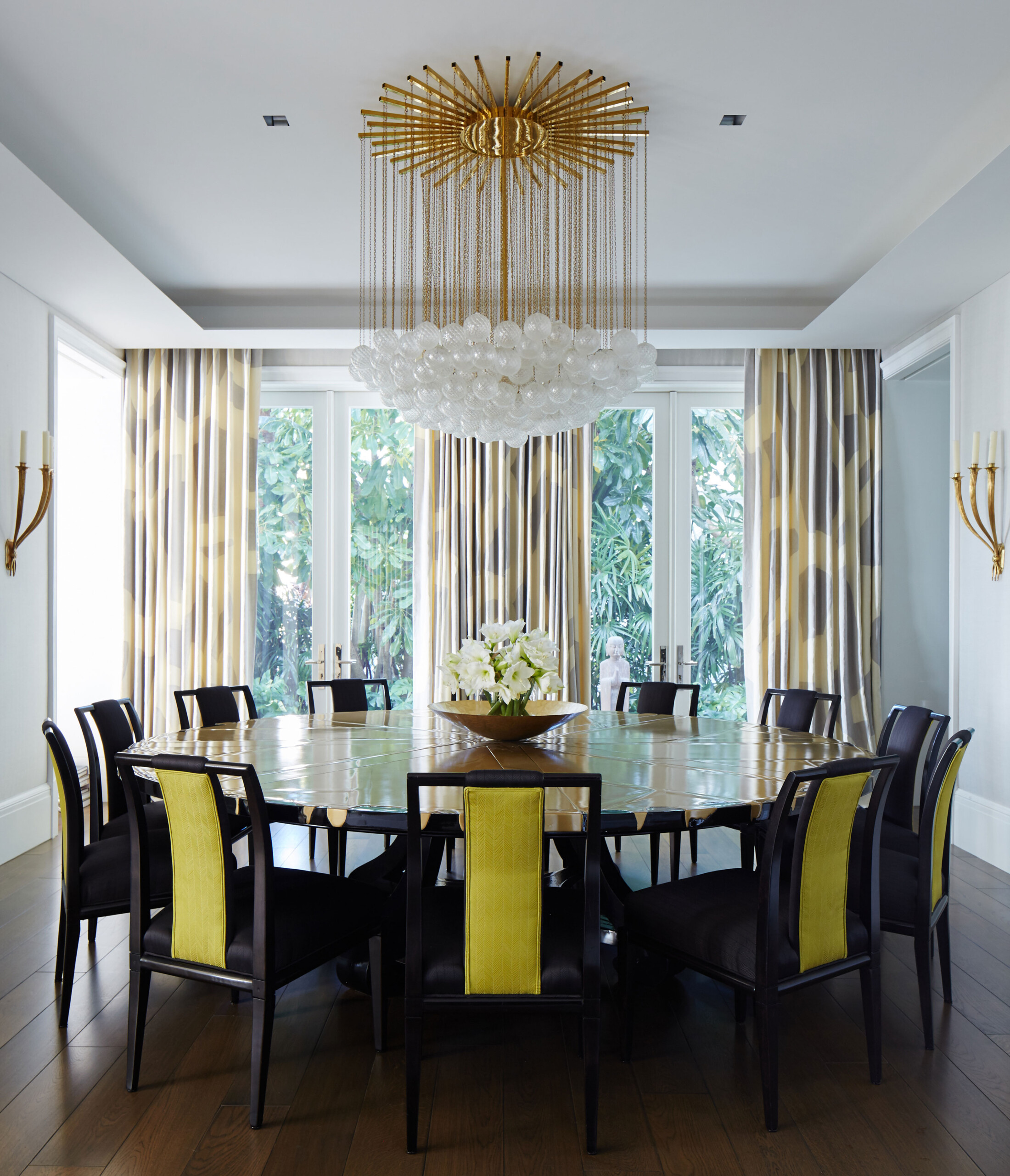 Lakefront Home - Dining room in Palm Beach, FL home with large circular table, yellow accent dining...
