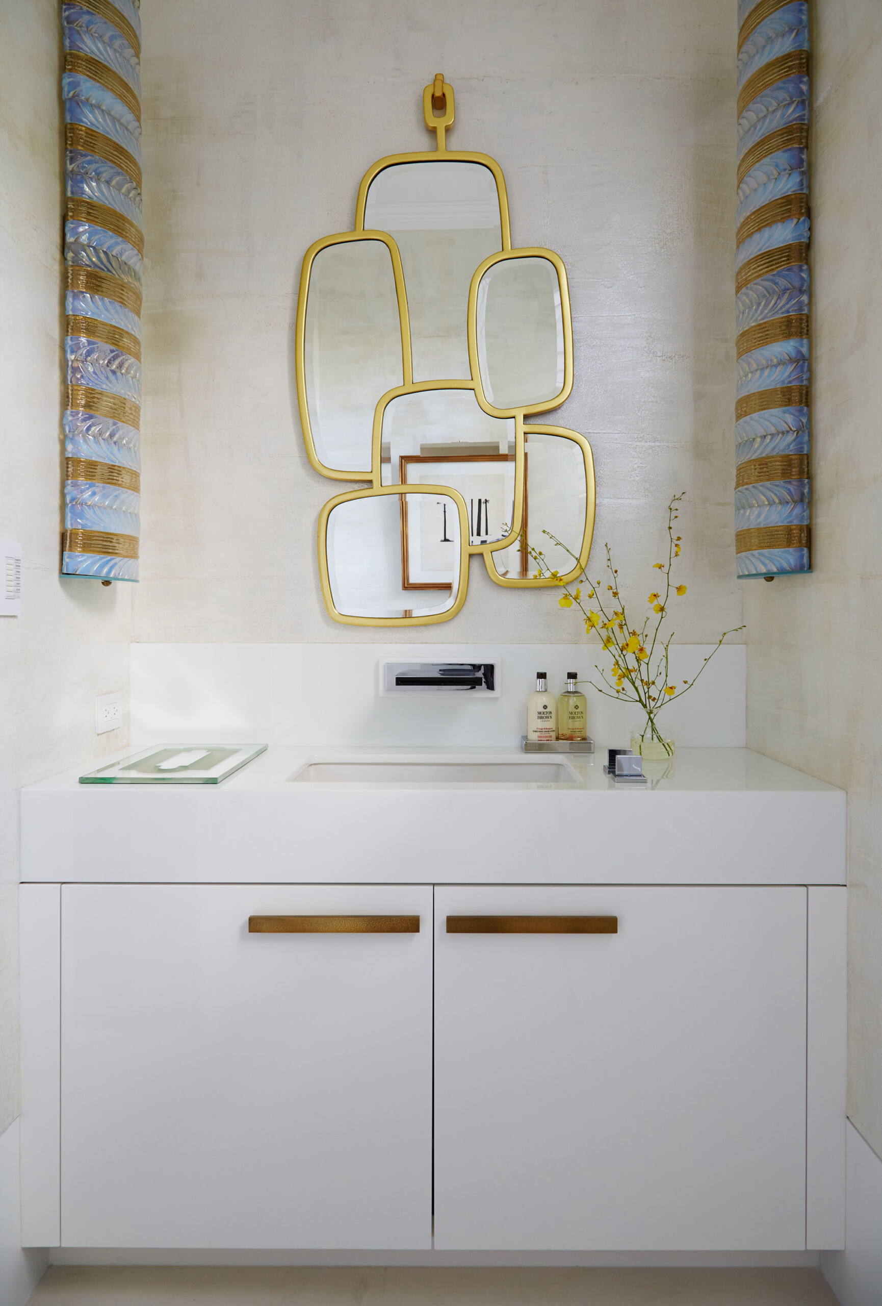 Lakefront Home - Palm Beach white vanity with brass mirror. Interior design by Pembrooke & Ives....