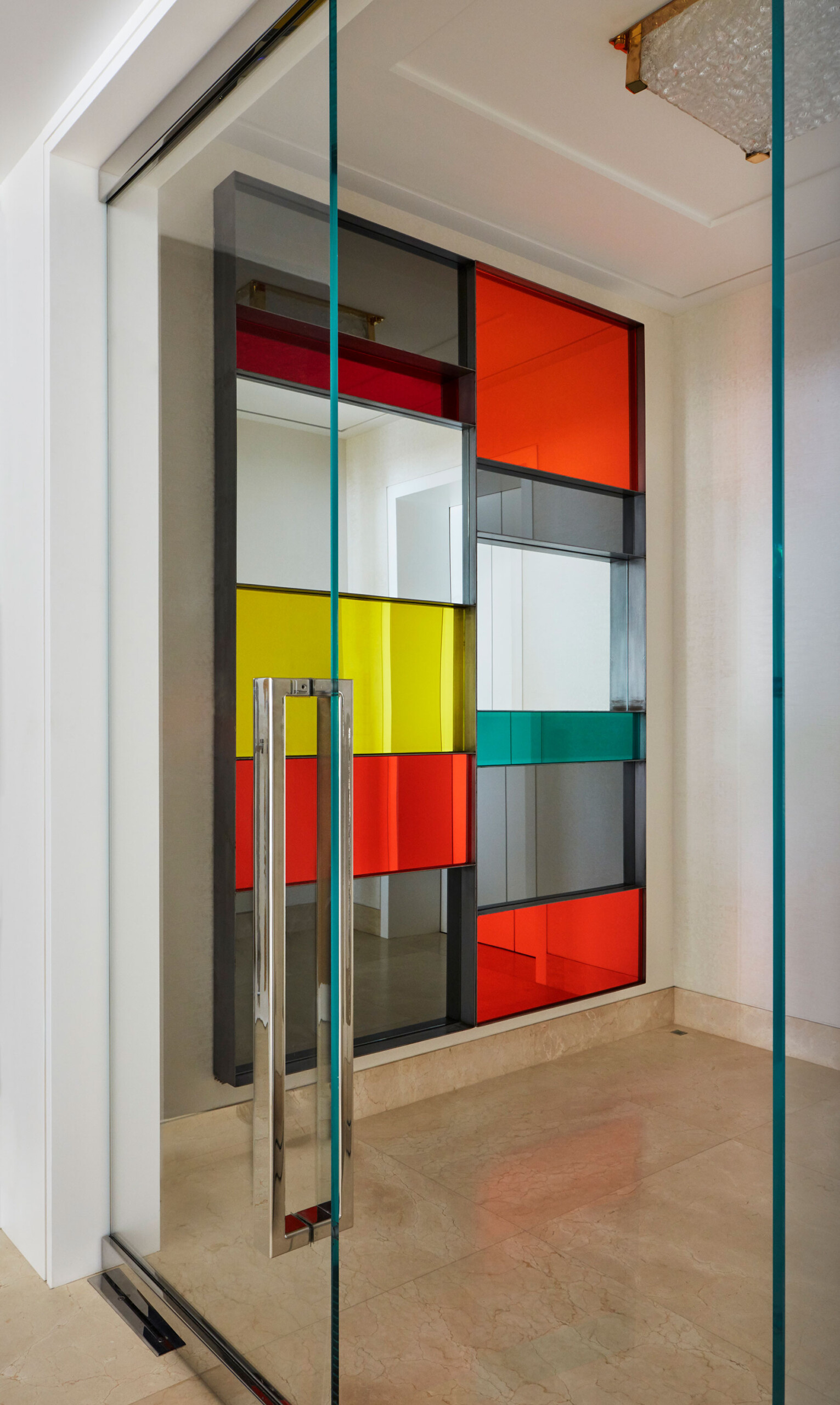 Palm Beach Apartment - Colorful accent wall in Palm Beach apartment. Interior design by Pembrooke...