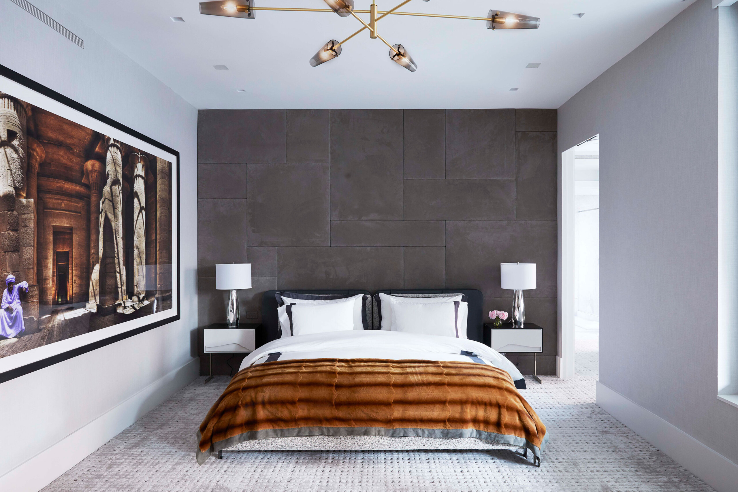 Leonard Street - Modern bedroom in Tribeca, NY home with grey accent wall, glass and brass lighting....