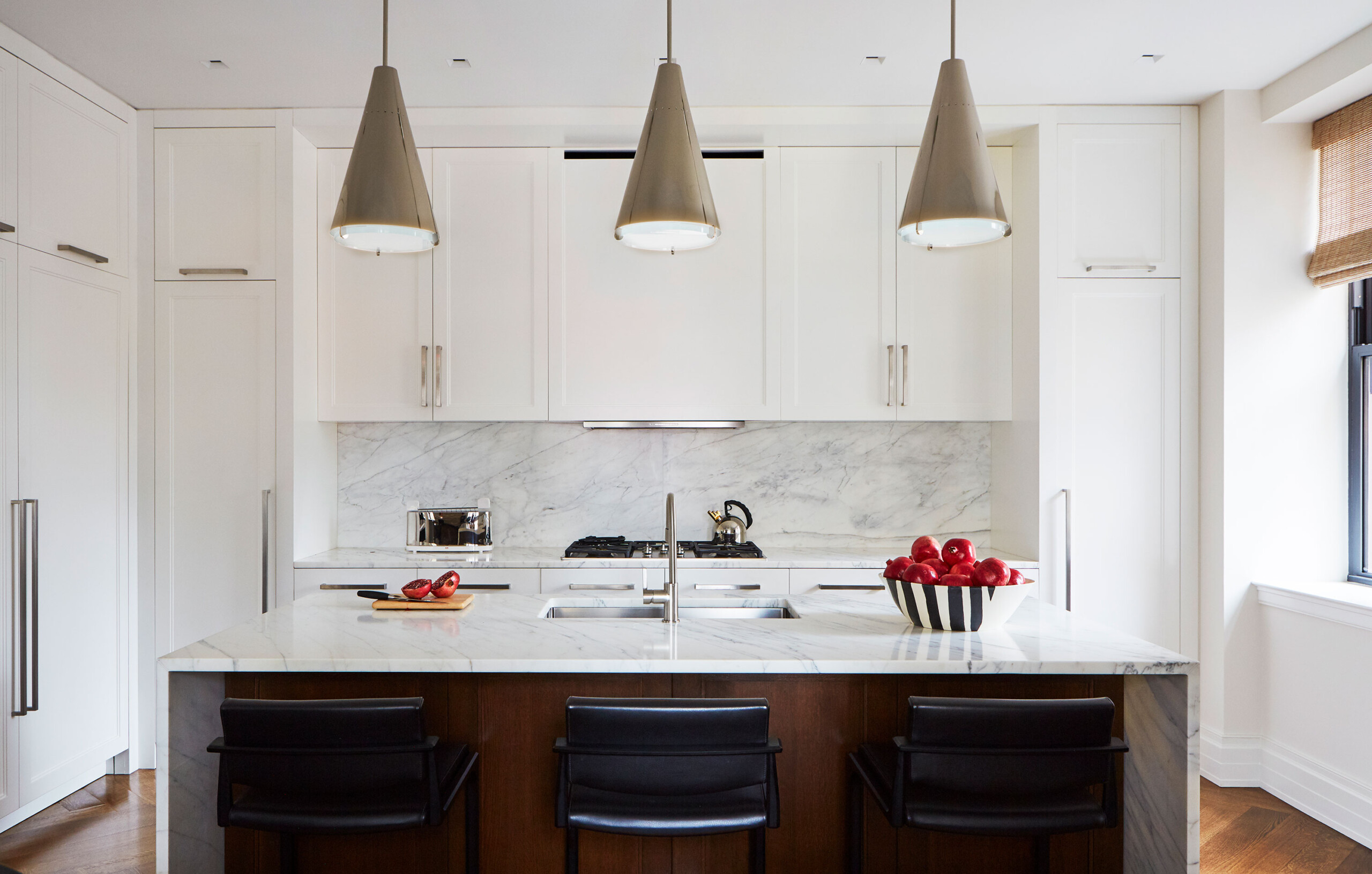 Upper West Side - Contemporary kitchen with white marble backsplash, cone pendant lighting and...