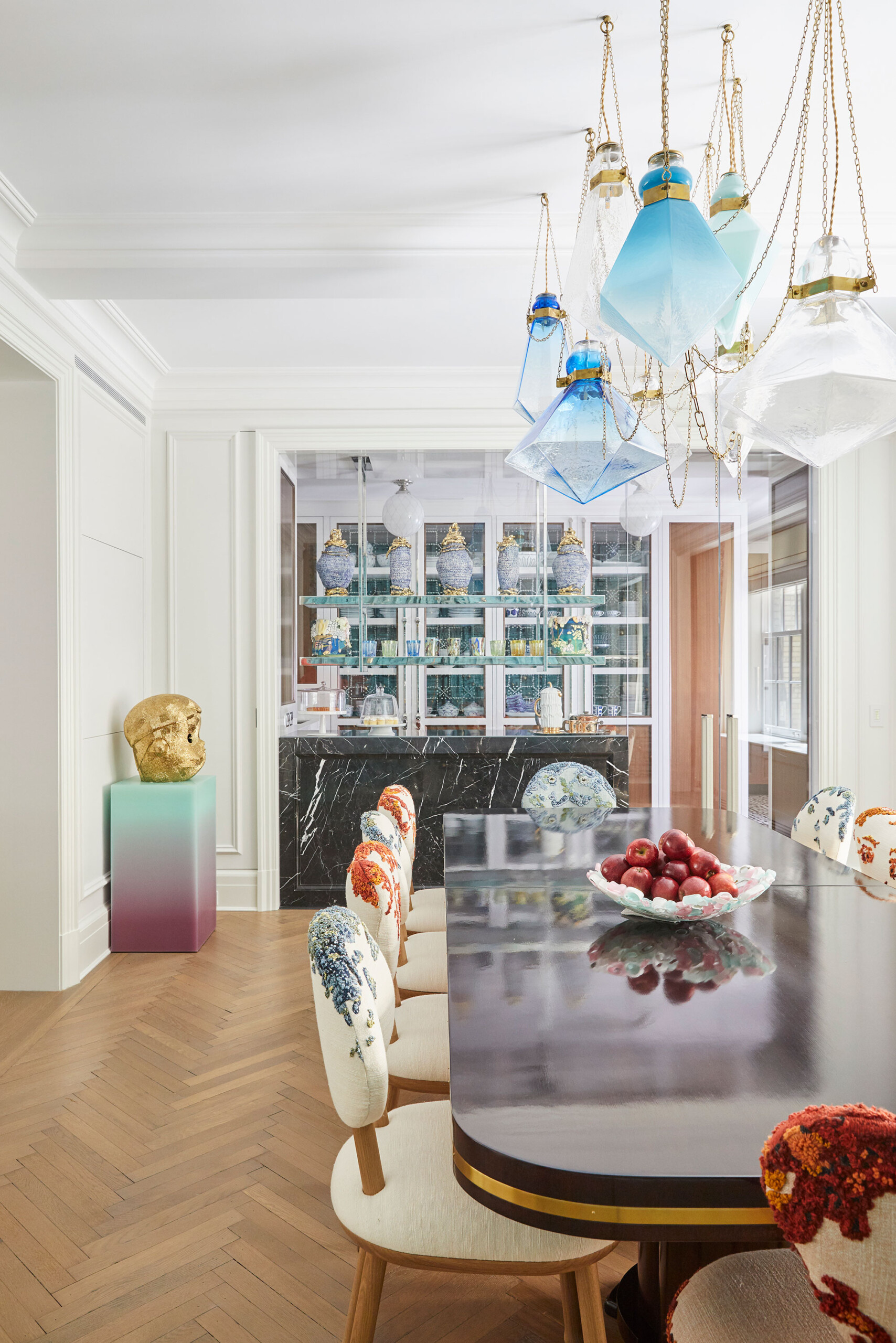 Uptown Eclectic - Pembrooke & Ives - Eclectic dining room design with modern rounded table, marble...