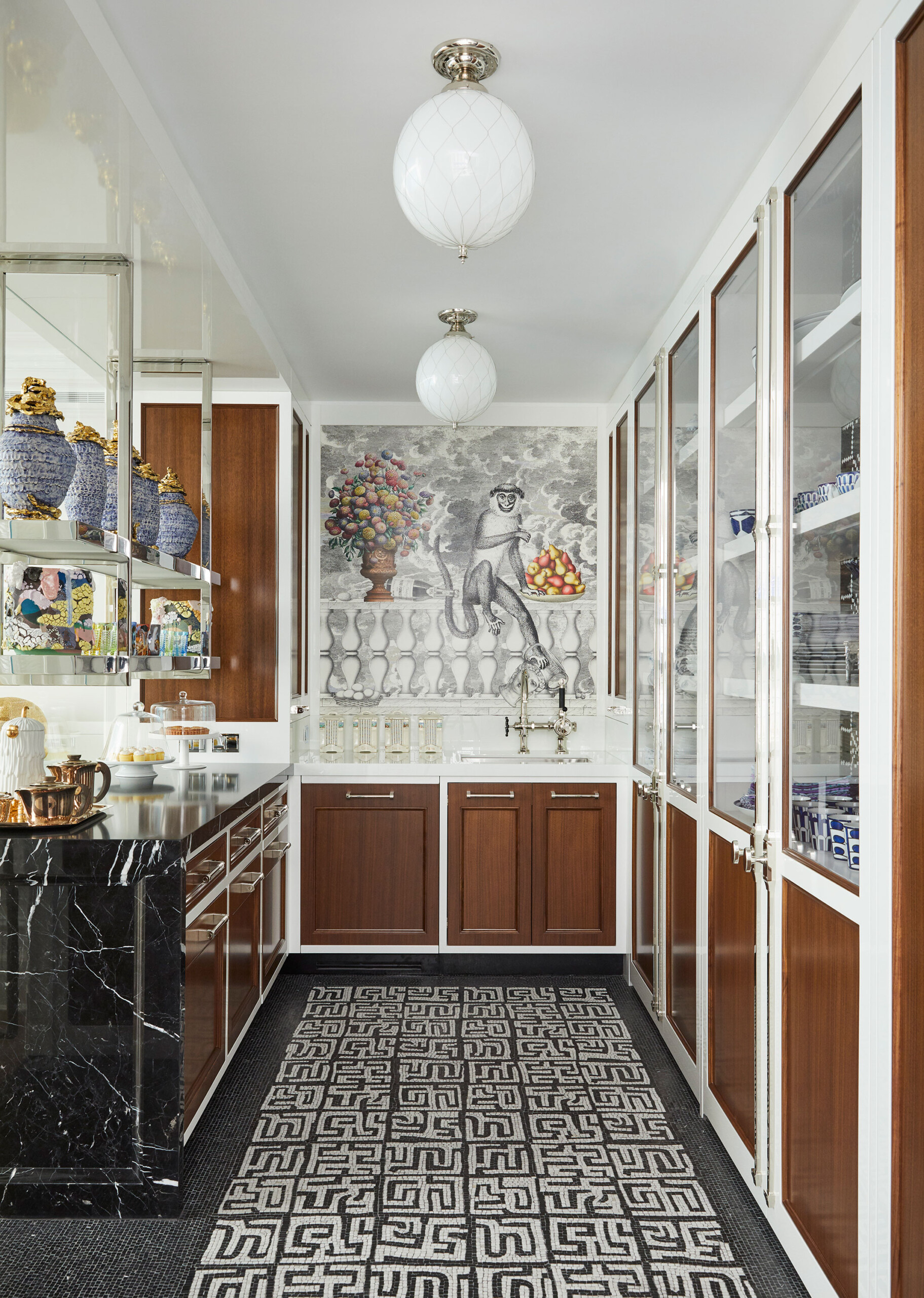 Uptown Eclectic - Pembrooke & Ives - Eclectic kitchen with walnut cabinets, marble counter and...