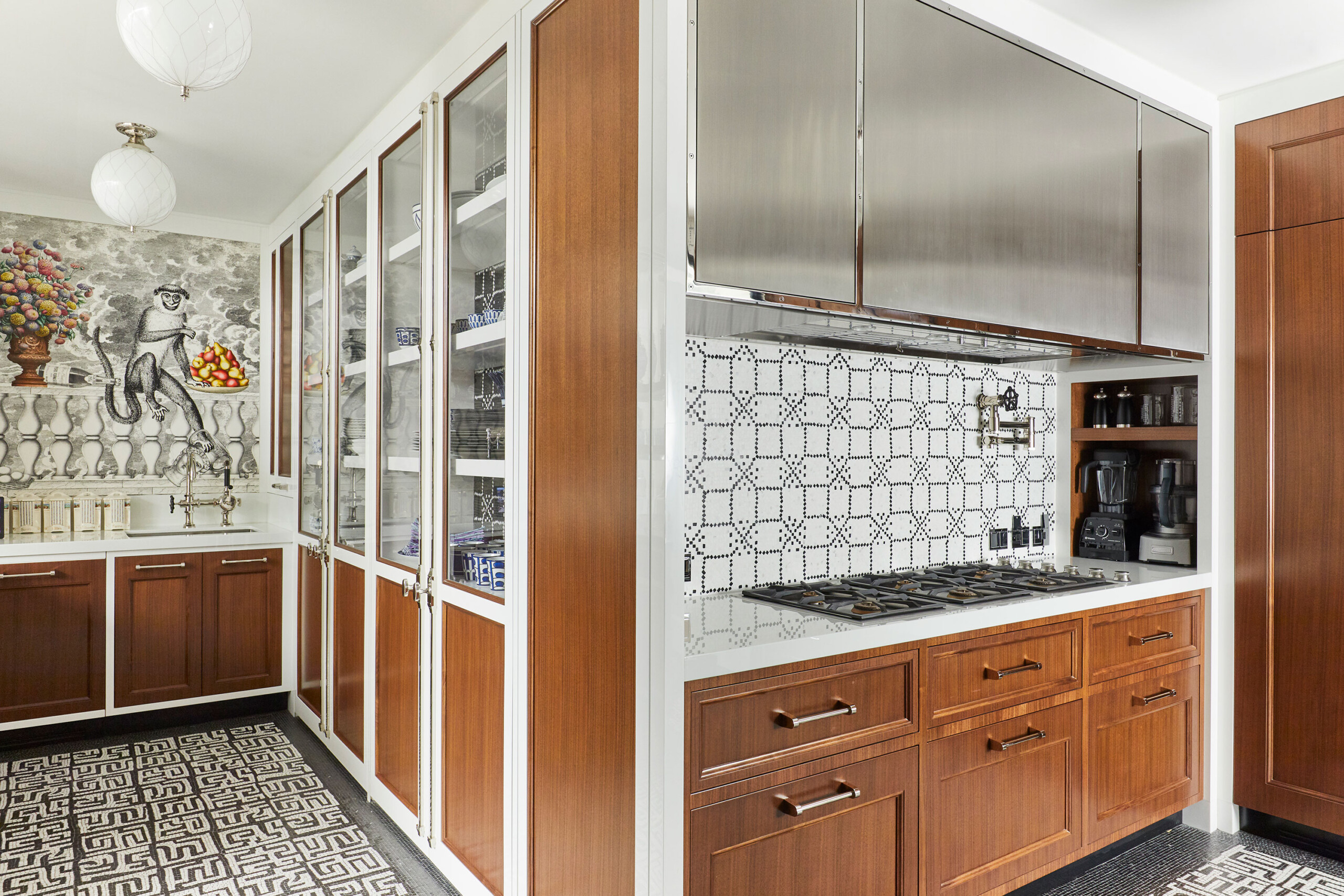 Uptown Eclectic - Pembrooke & Ives - Eclectic kitchen with walnut cabinets, marble counter and...