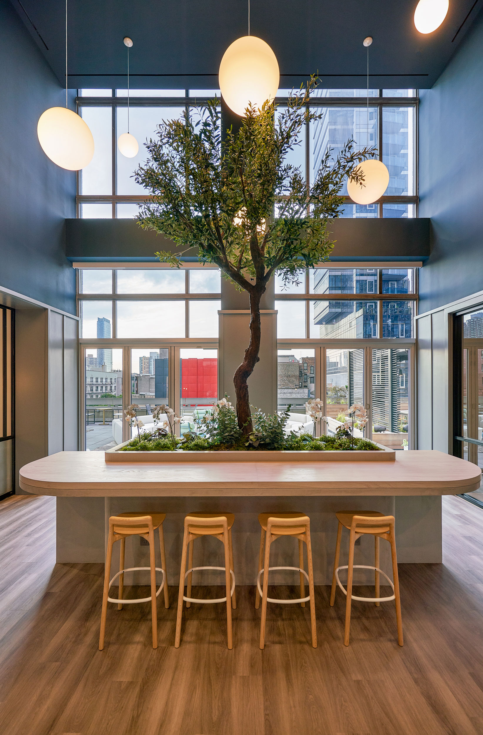 The Biltmore - Bar-height seating area in The Afton, New York. Interior design by Pembrooke & Ives....