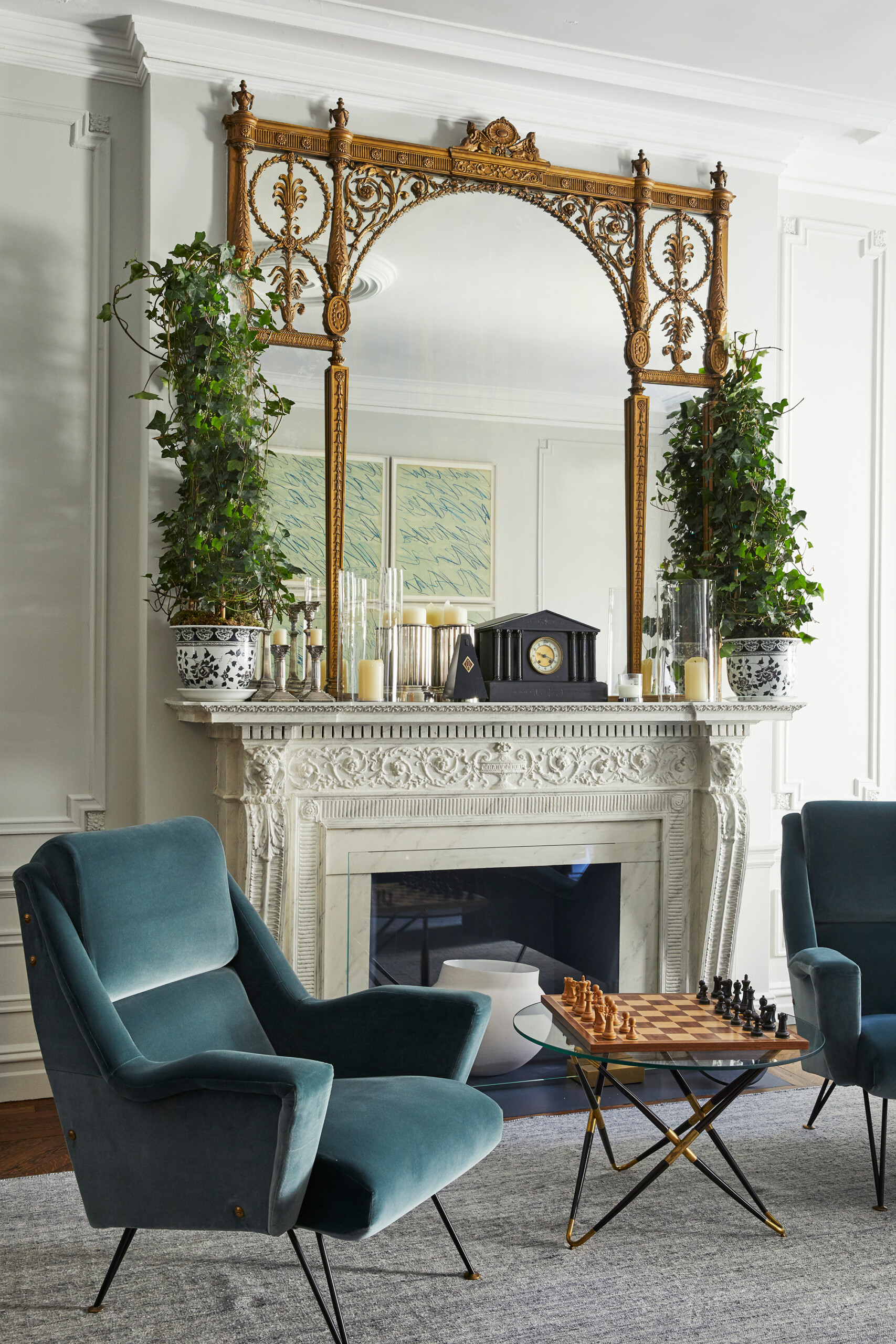 West Side Elegance - Pembrooke & Ives - West Side living room design with teal accent chairs, decorative...
