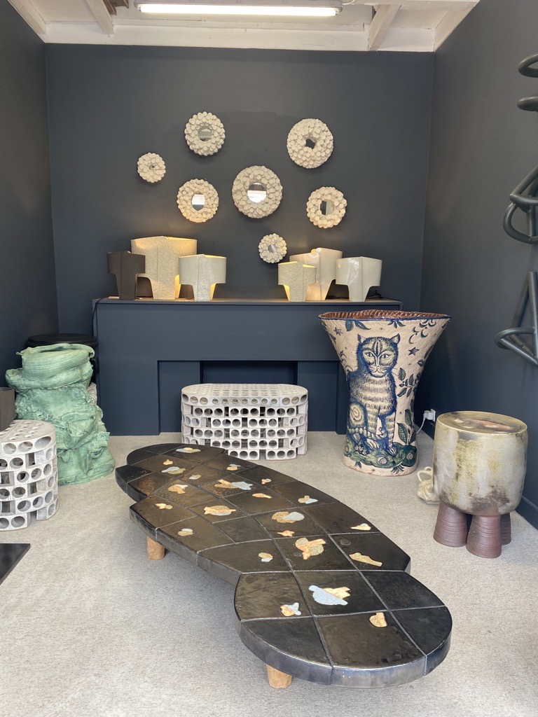 Paul Bert showroom in Paris, featuring cat vase, illuminating lights