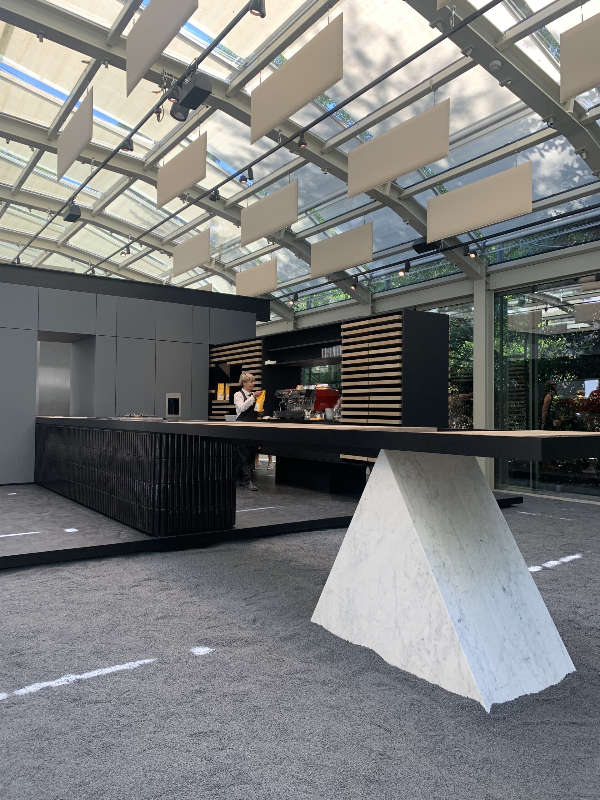 Salone del Mobile 2022, Gagenau features their Geometric table with triangle legs. with black and...