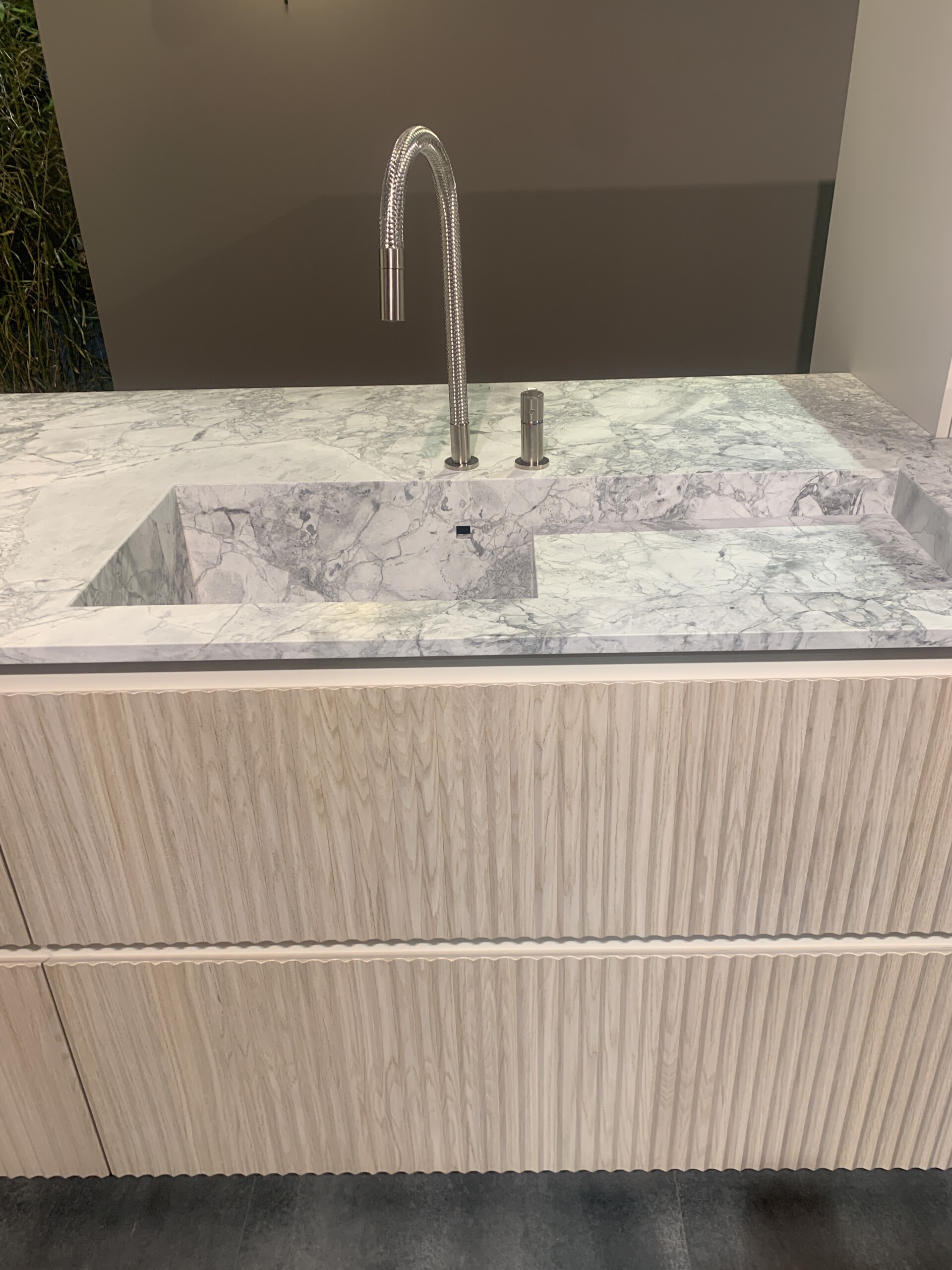 Scandola Fluted Wood at Salone del Mobile 2022 showcasing their marble sinks with contrasting draws
