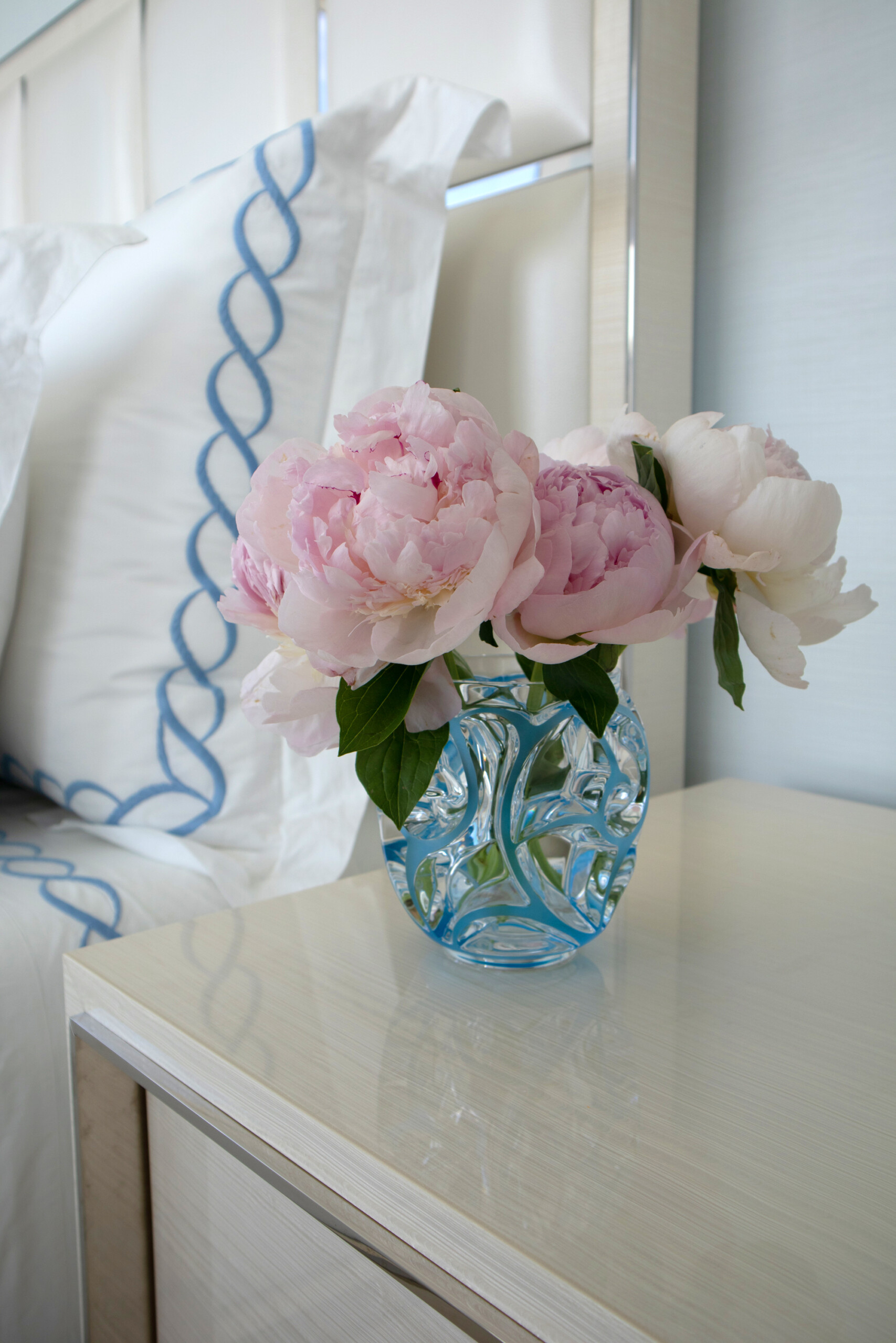Peonies in glass vase for interior design staging by Pembrooke & Ives.