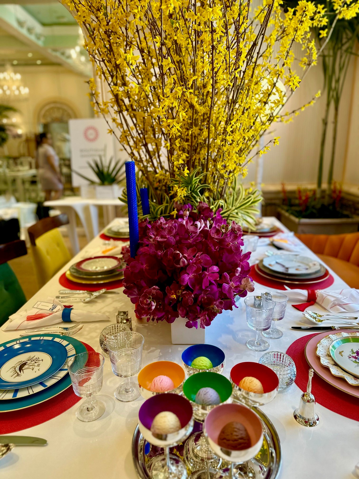 colorful place setting with whimsical flowers in Holiday House 2023, Palm Beach, Florida.