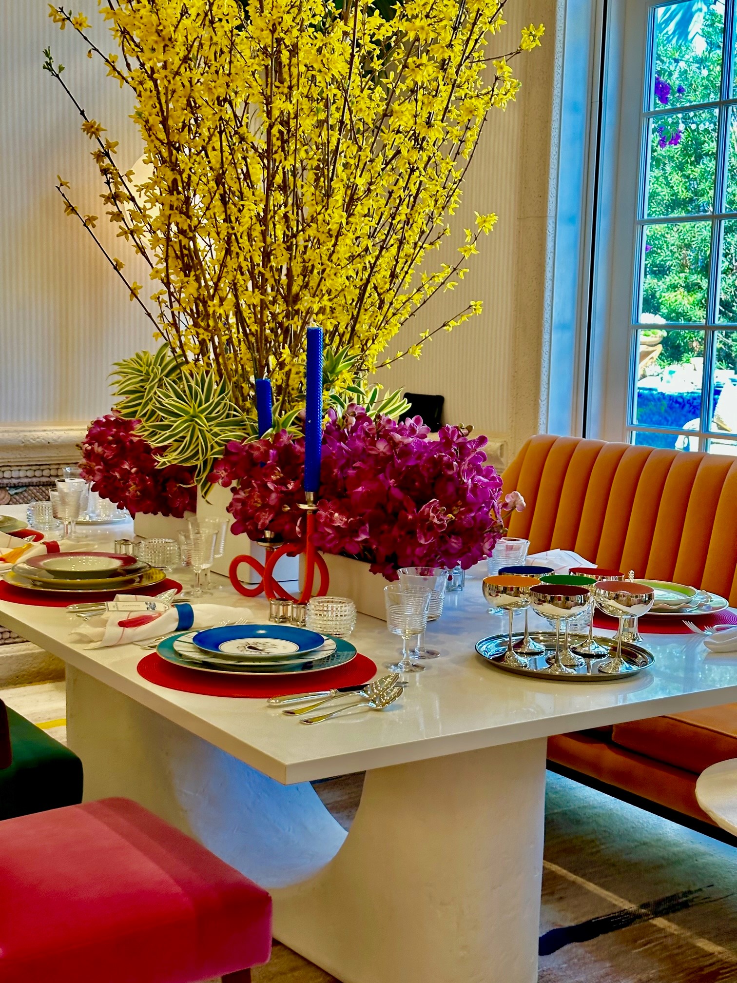 colorful place setting with whimsical flowers in Holiday House 2023, Palm Beach, Florida.
