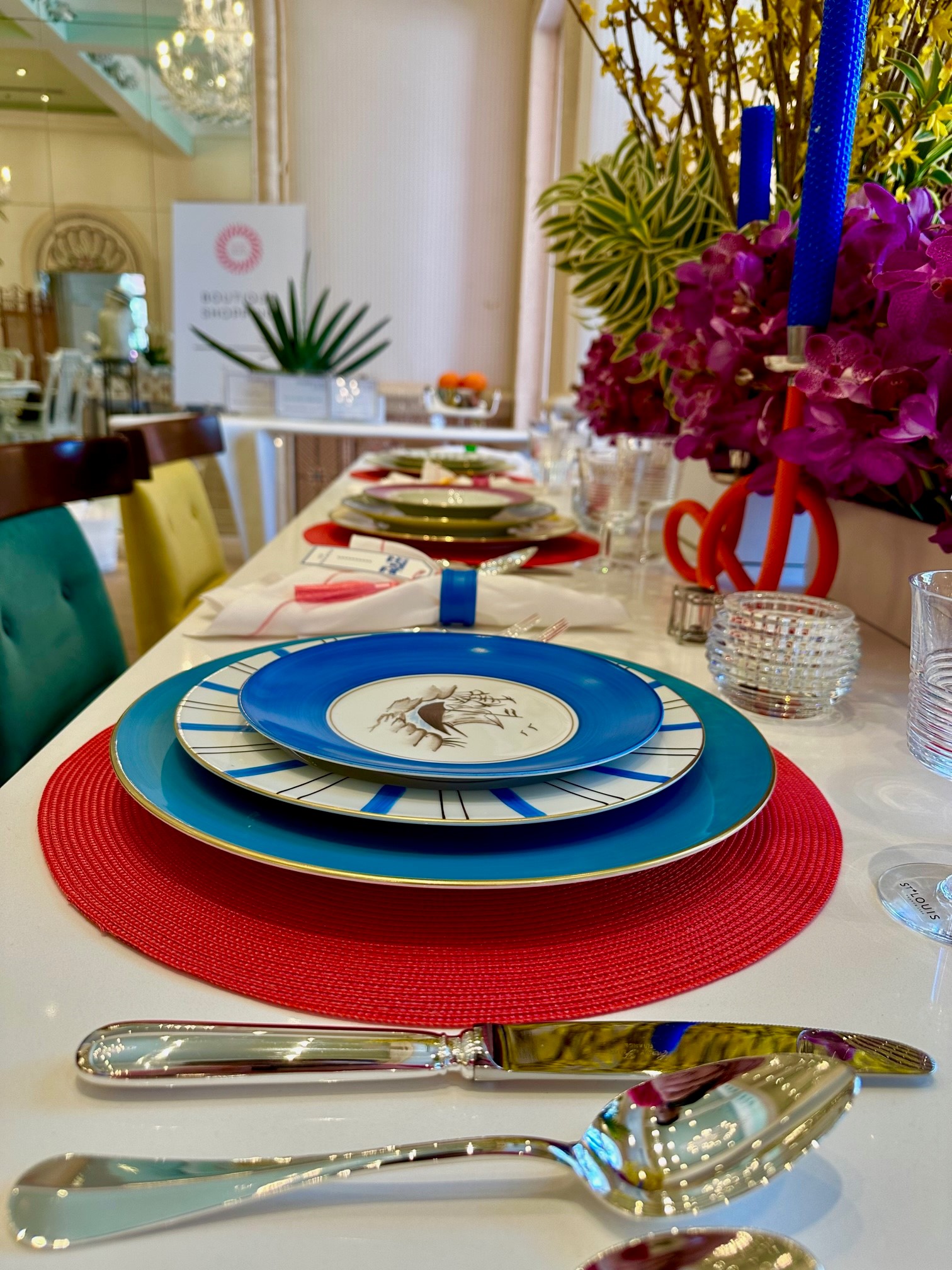 colorful place setting with whimsical flowers in Holiday House 2023, Palm Beach, Florida.