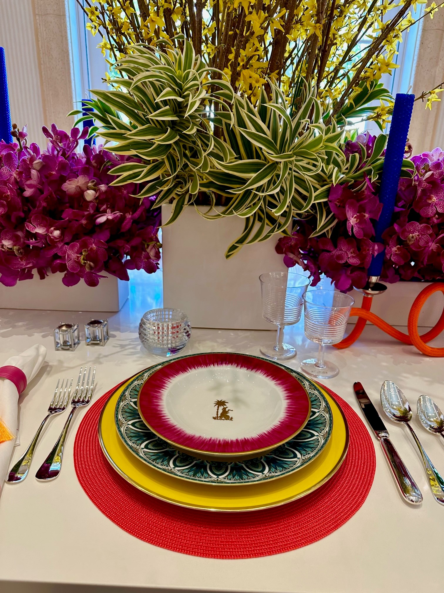 colorful place setting with whimsical flowers in Holiday House 2023, Palm Beach, Florida.