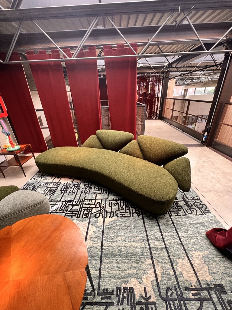 Nilufar modern sofa in olive green from Milan Design Week 2023.