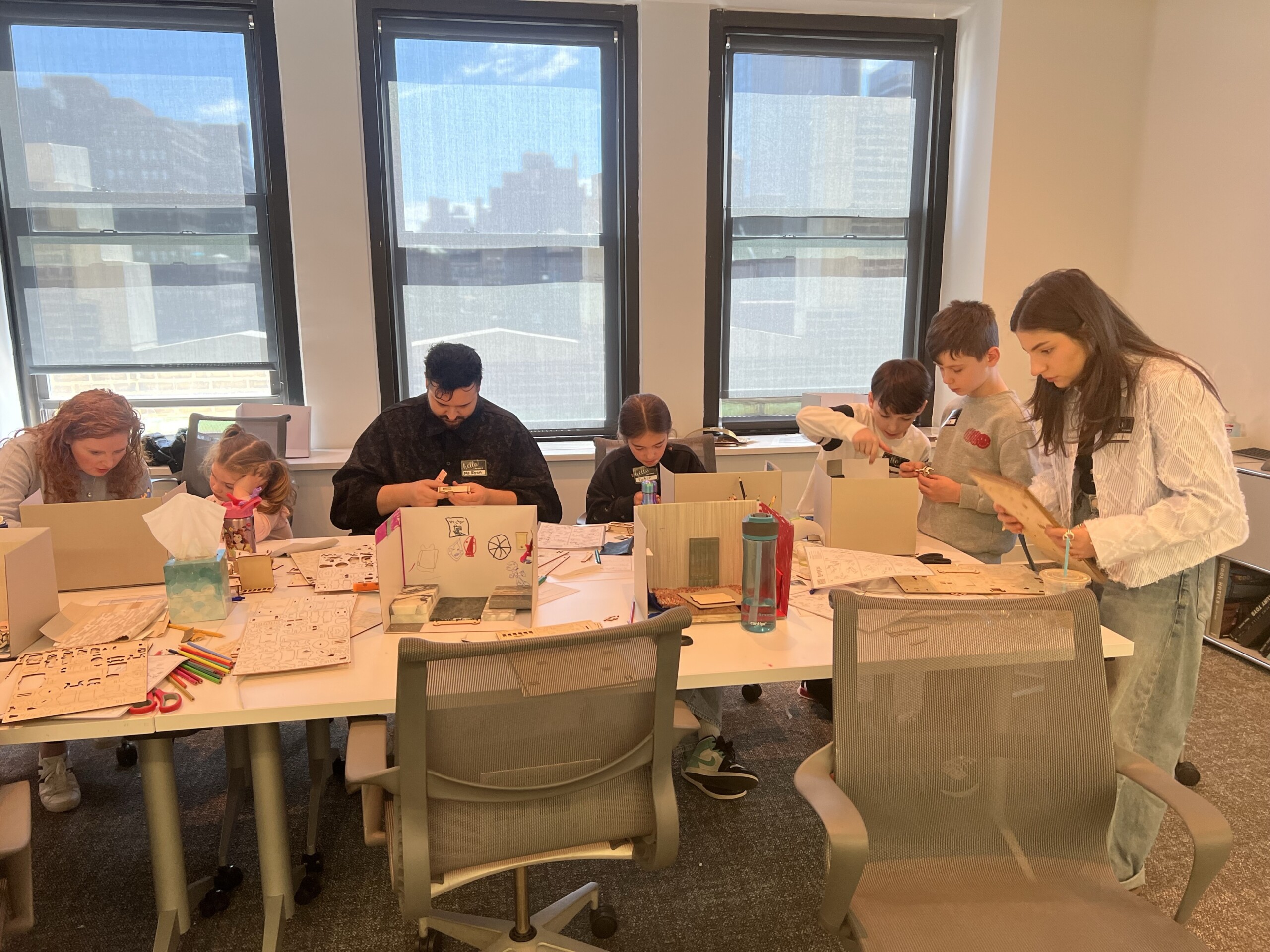 Children build 3-d mockup of their dream house for Pembrooke & Ives Bring your kids to work day