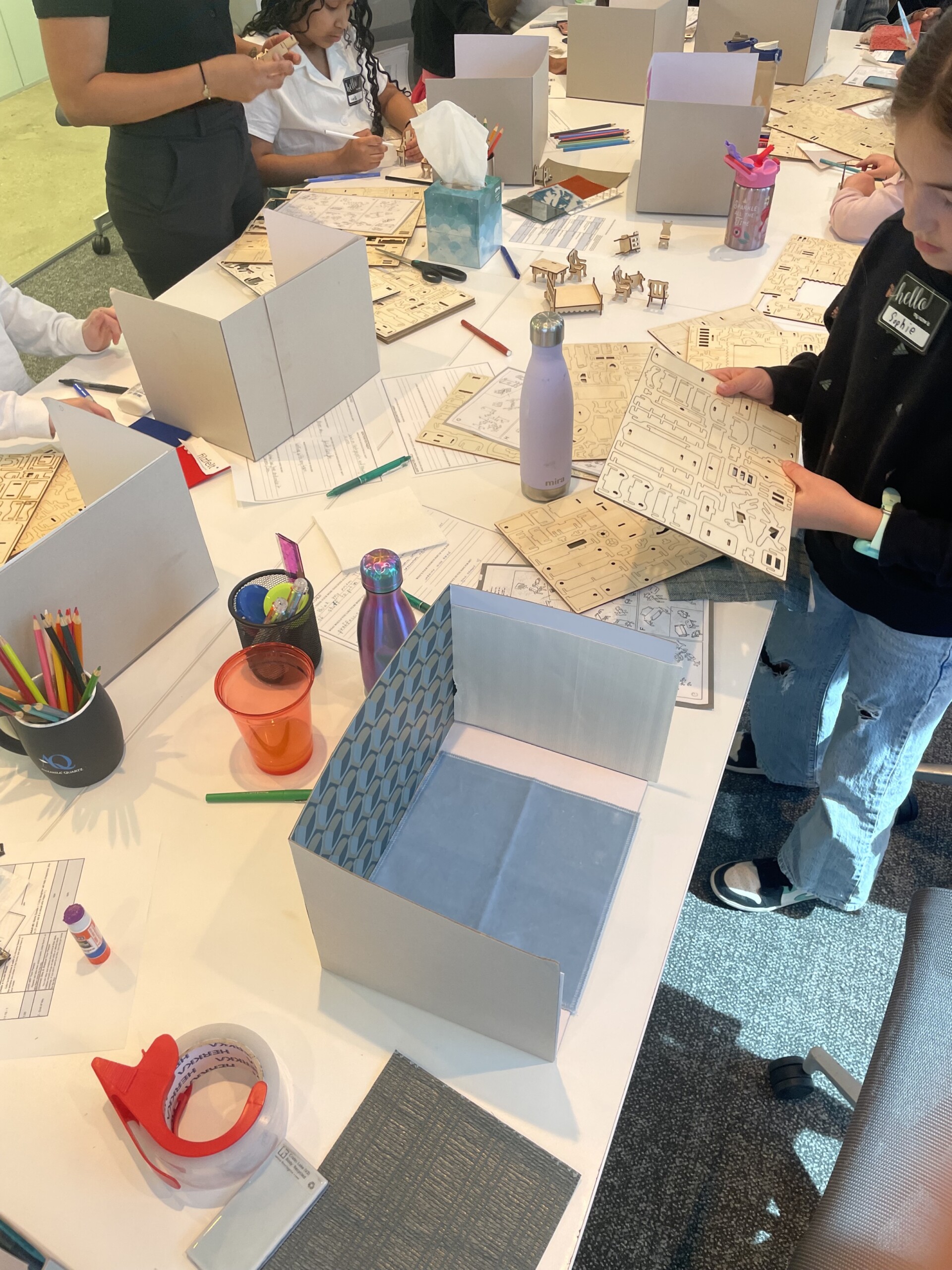 Children build 3-d mockup of their dream house for Pembrooke & Ives Bring your kids to work day