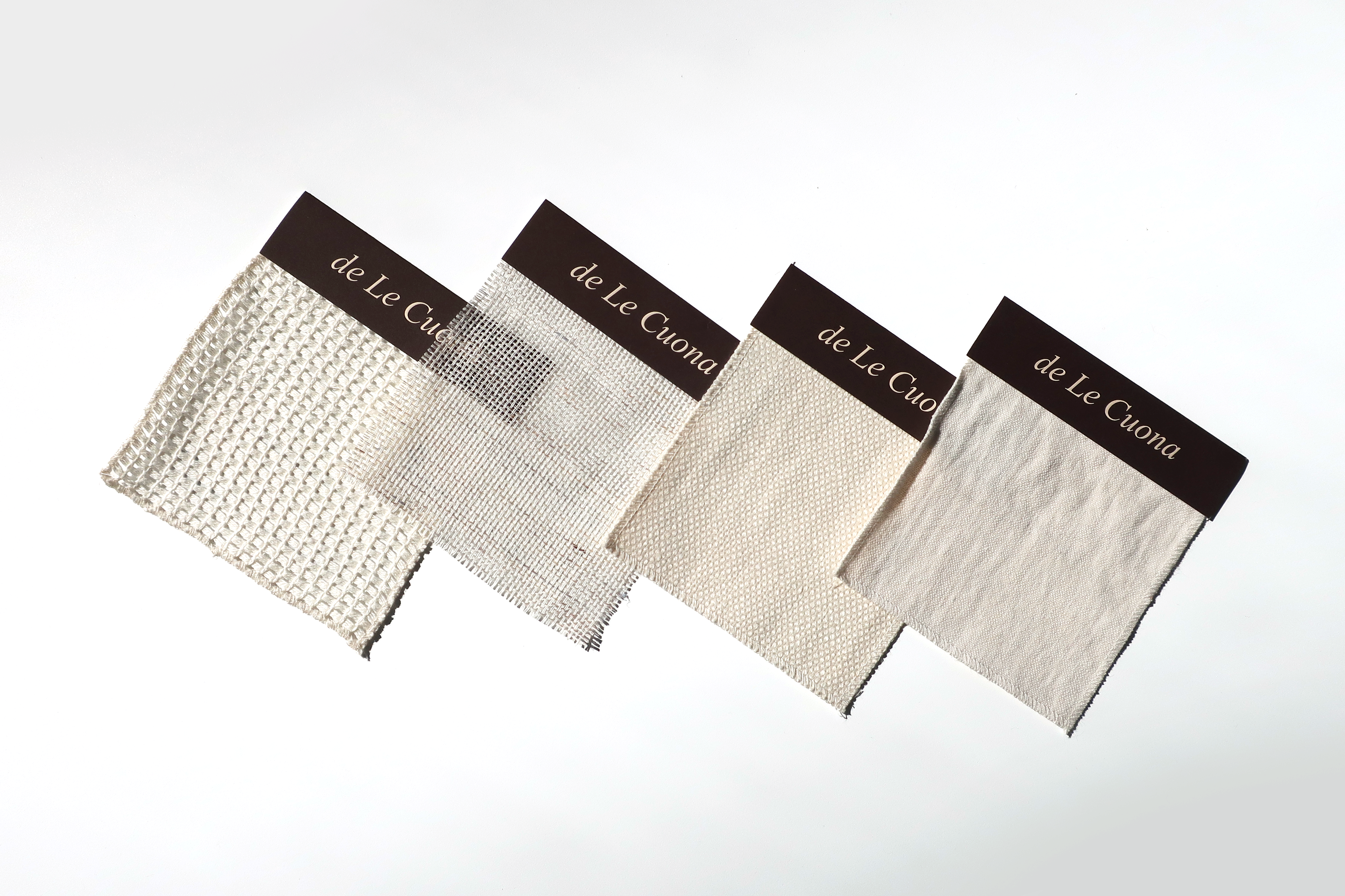De Le Cuona, cream textured fabric swatches